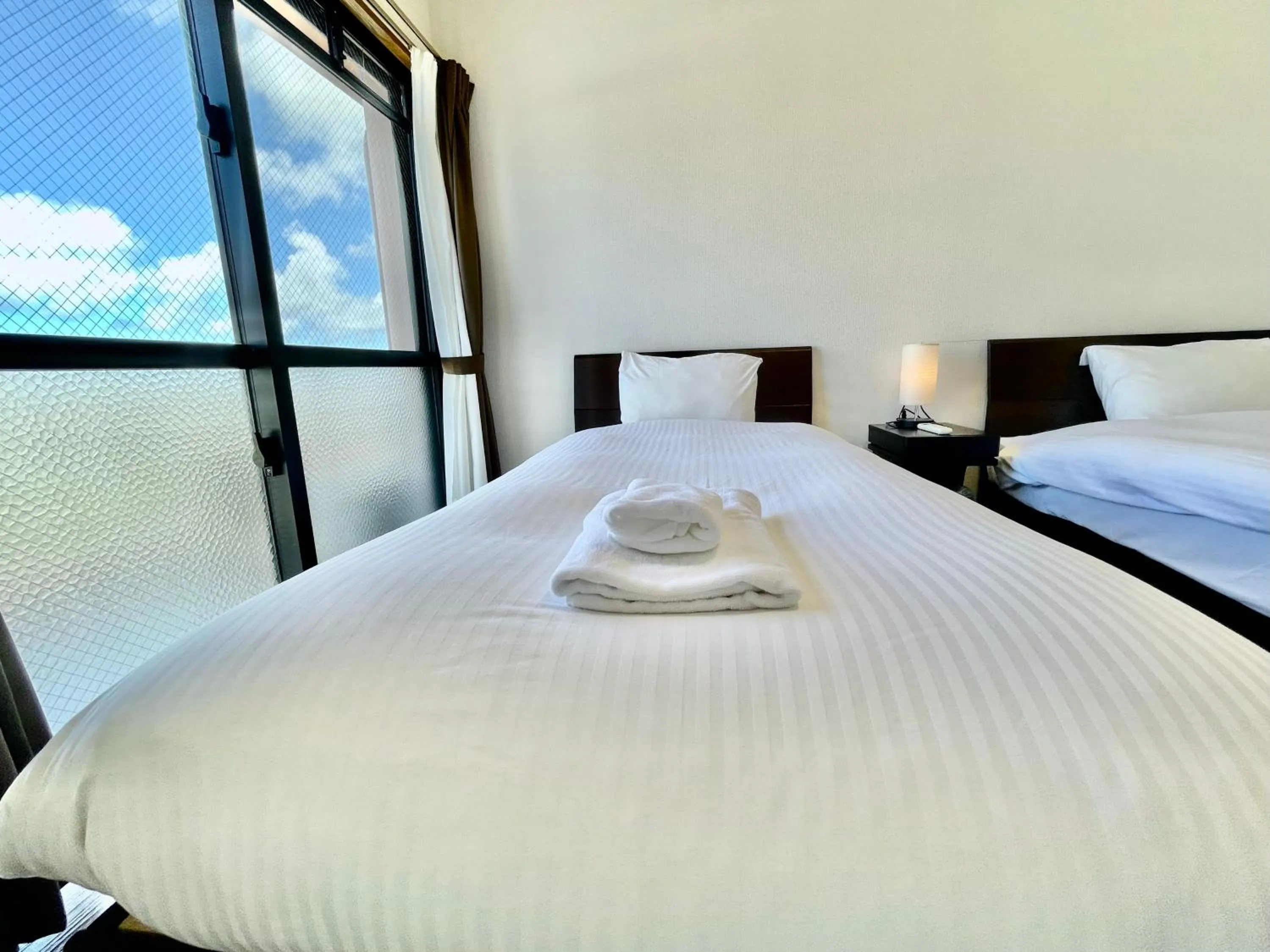 Bed in ホテル天使館 久茂地 -Tenshi-Kan-