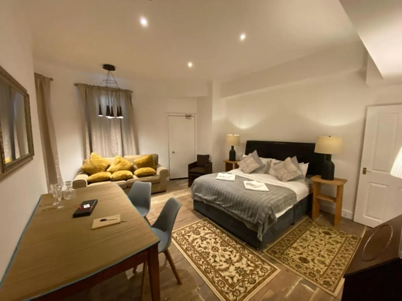 Photo of the whole room, Bed in Queen Street Boutique Suites