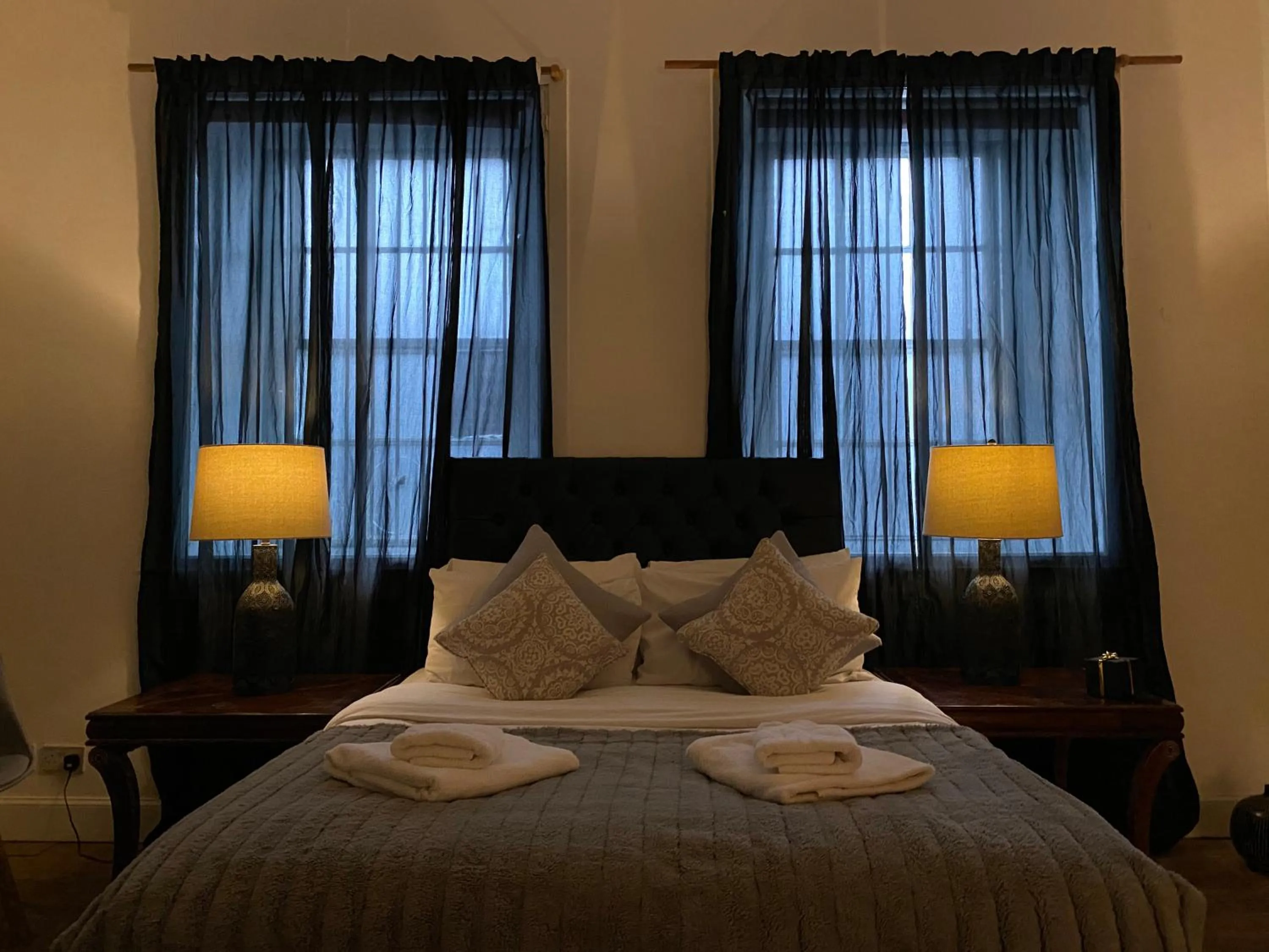 Bed in Queen Street Boutique Suites