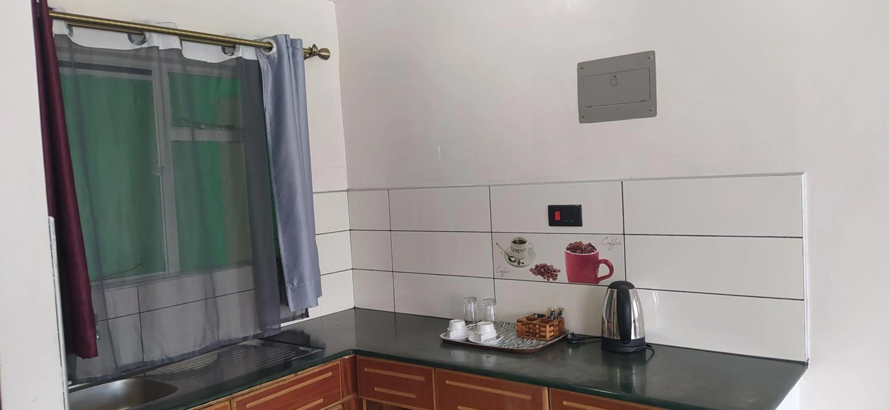 Kitchen or kitchenette in Plus254 Hotel