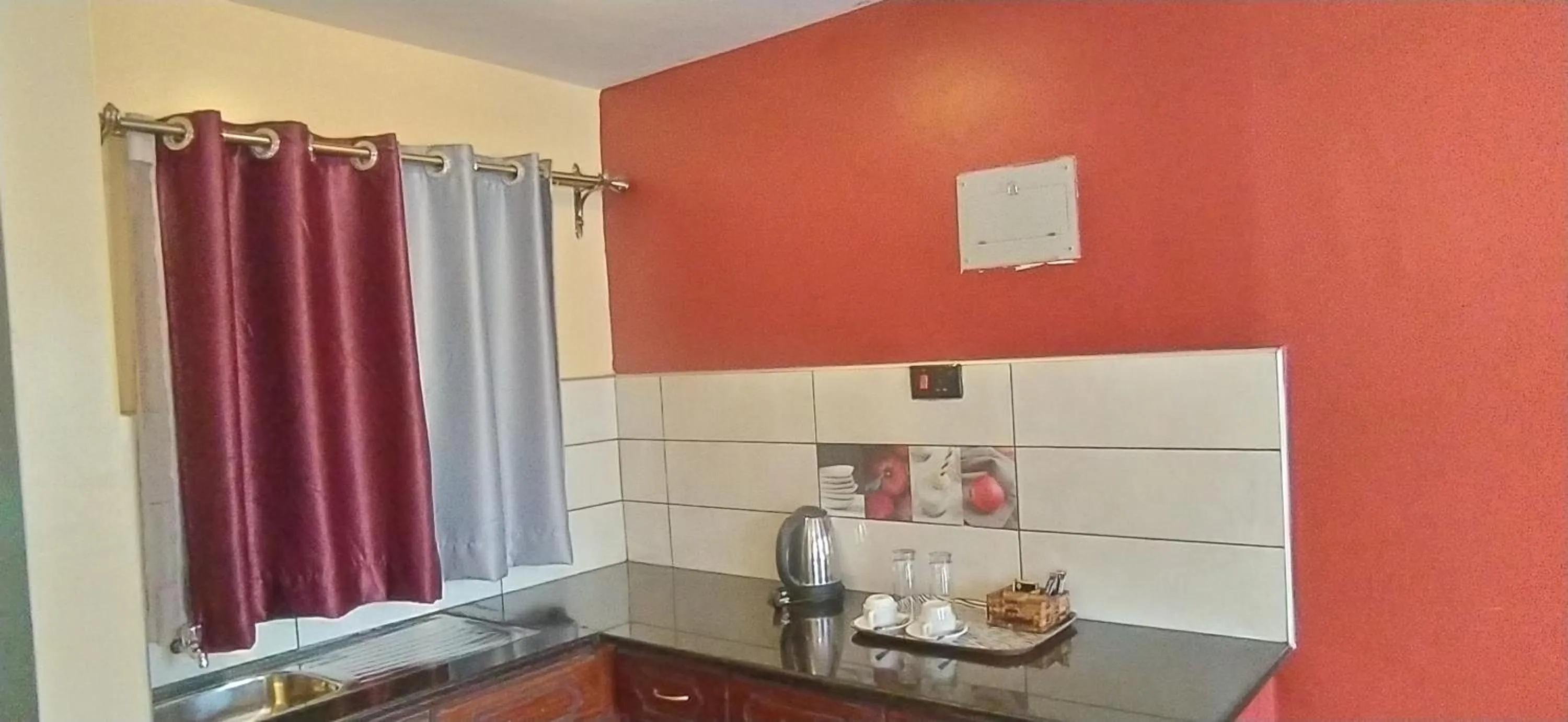 Kitchen or kitchenette in Plus254 Hotel