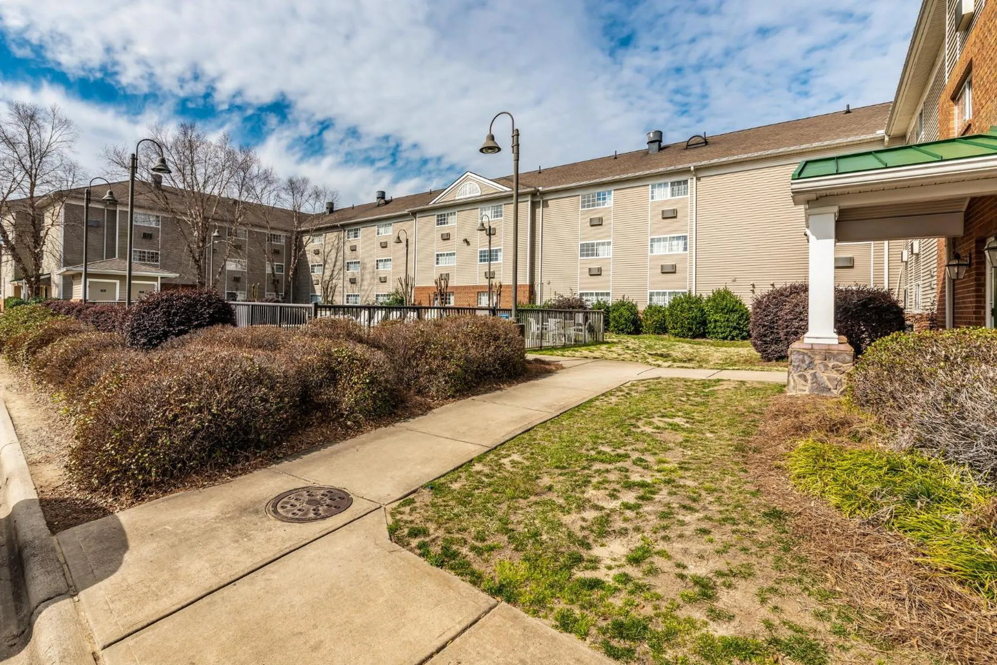 Property building in HomeTowne Studios & Suites by Red Roof Charlotte - Concord