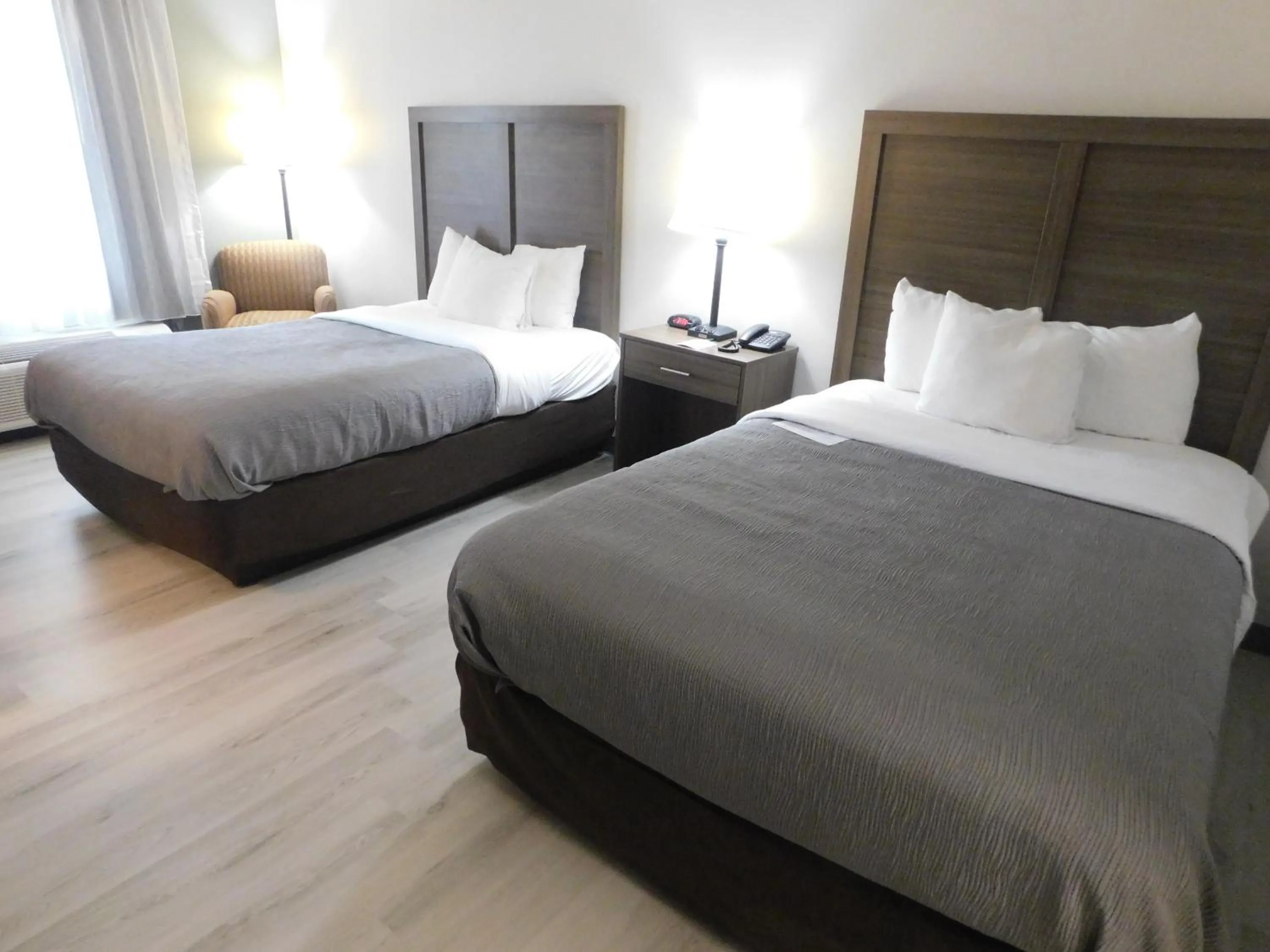 Bed in Quality Inn & Suites Hanes Mall