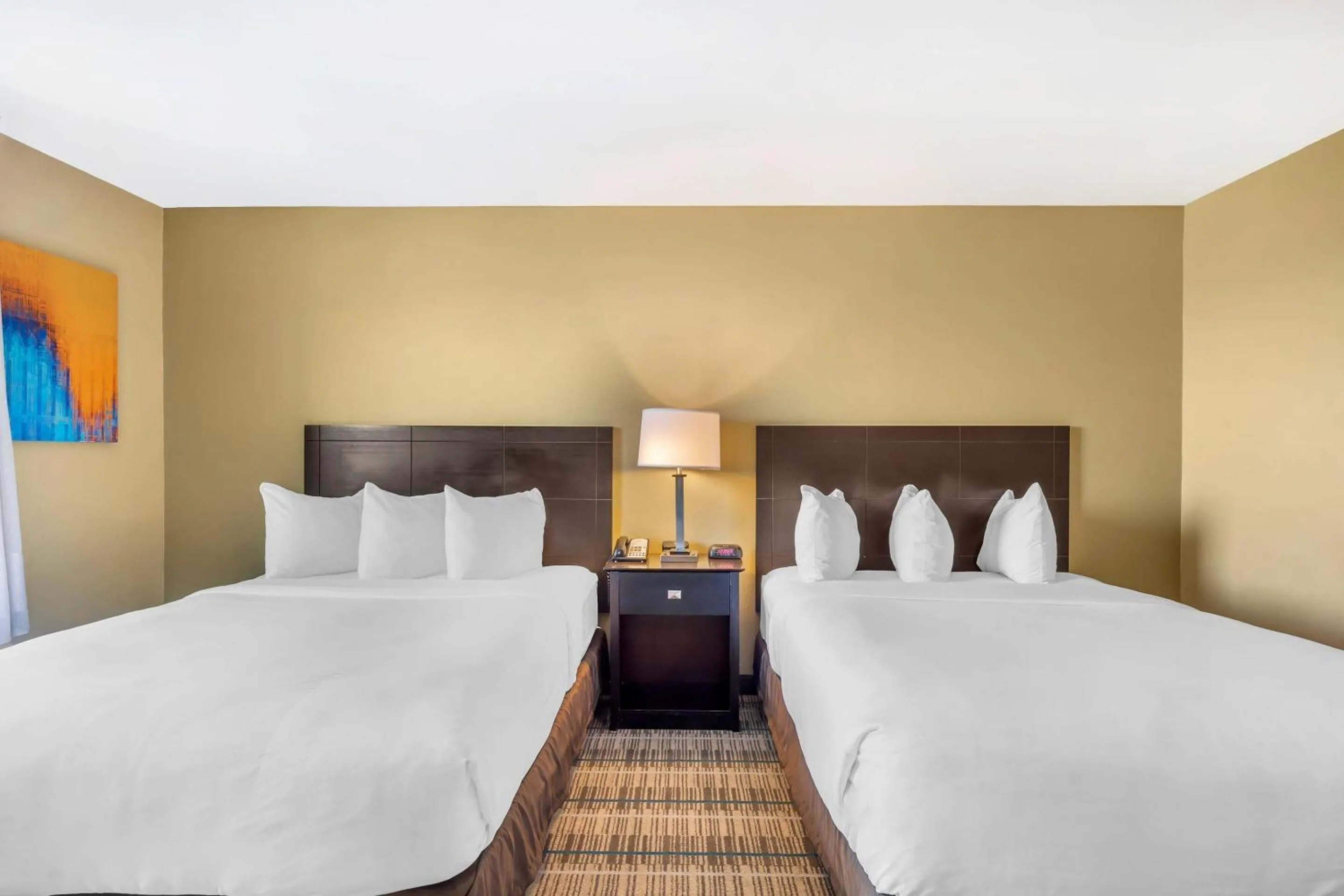 Bedroom, Bed in MainStay Suites Jacksonville near Camp Lejeune