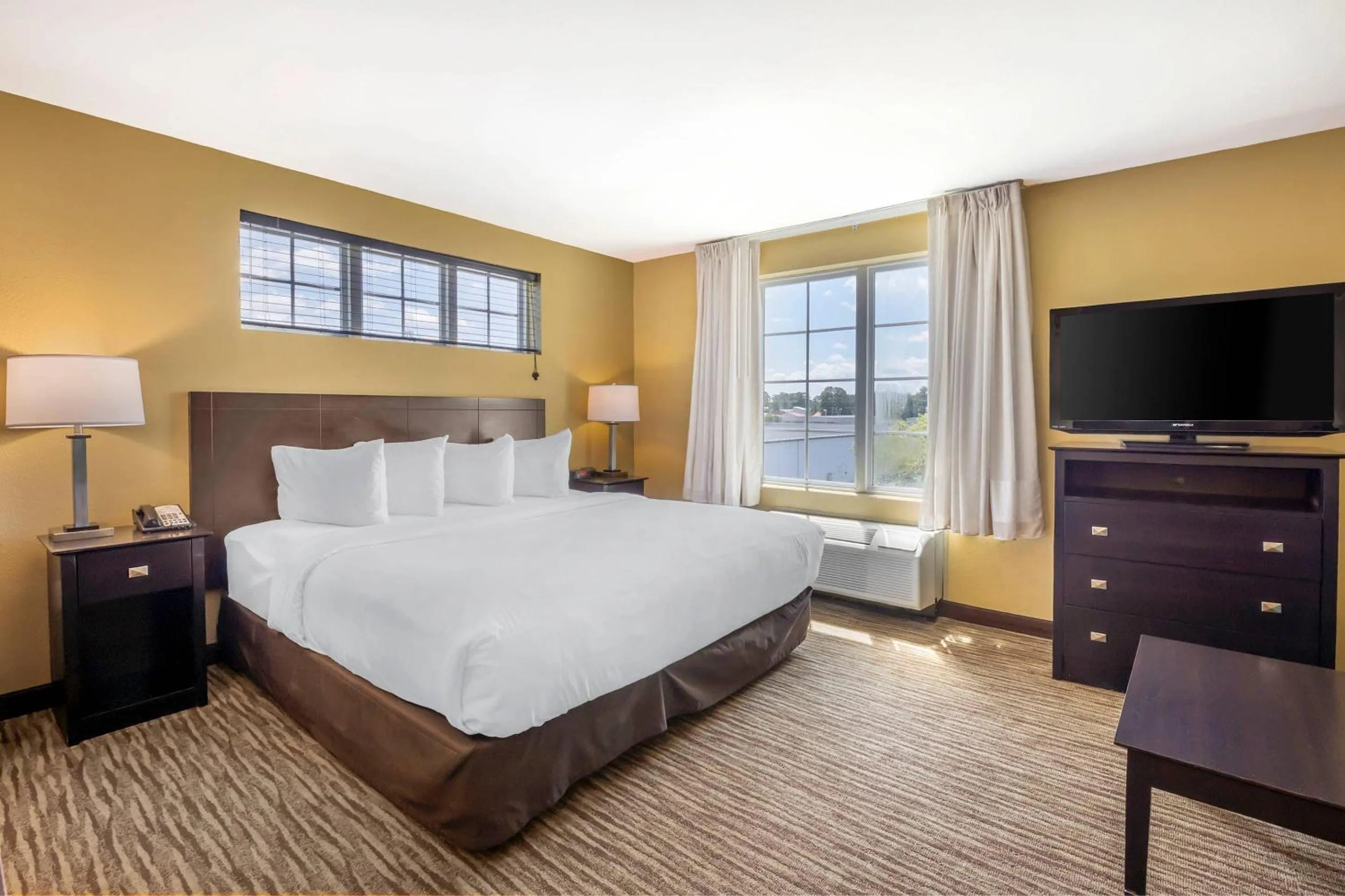 Bedroom, Bed in MainStay Suites Jacksonville near Camp Lejeune