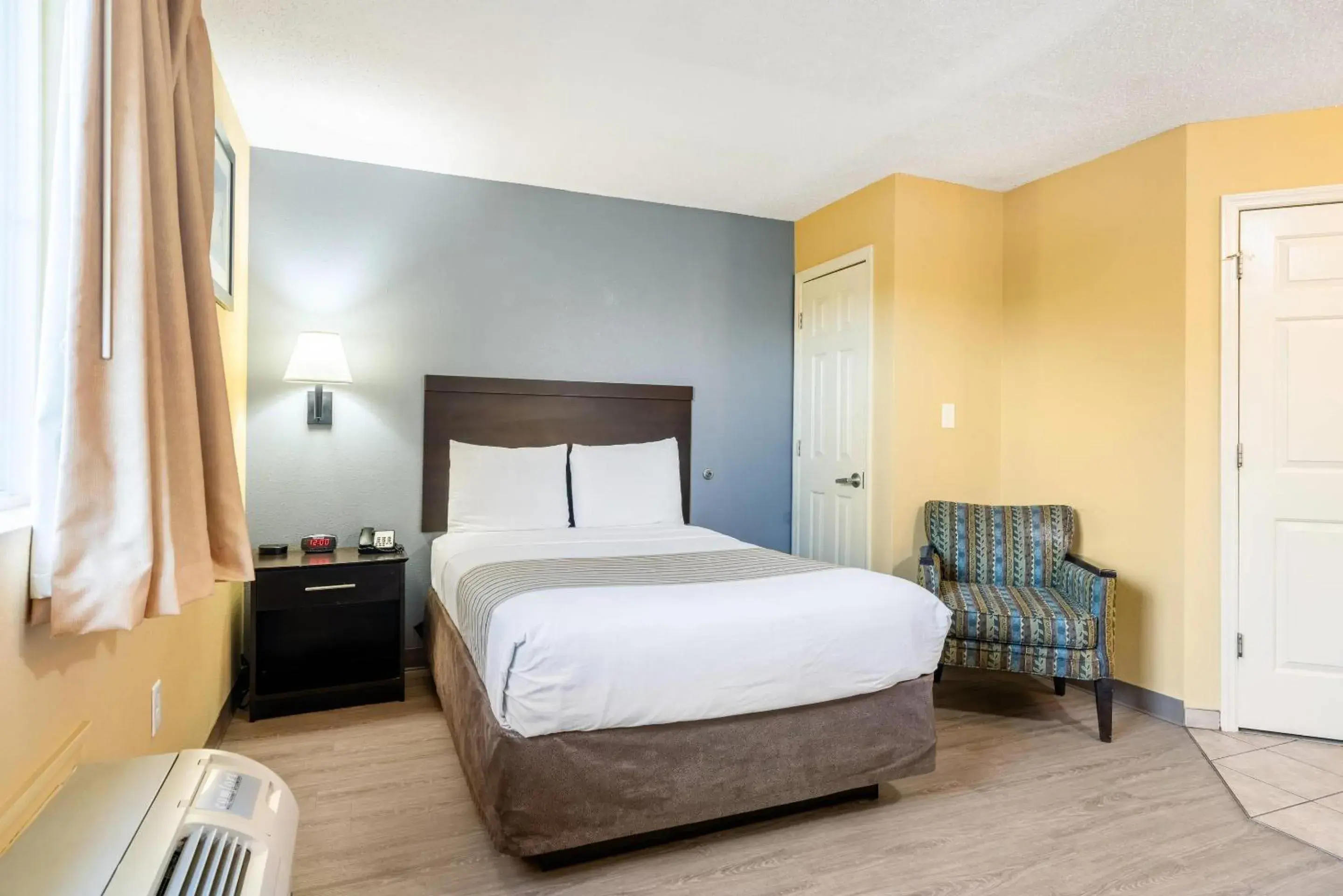 Bedroom, Bed in Suburban Studios Near Camp Lejeune Bedroom, Bed in Suburban Studios Near Camp Lejeune