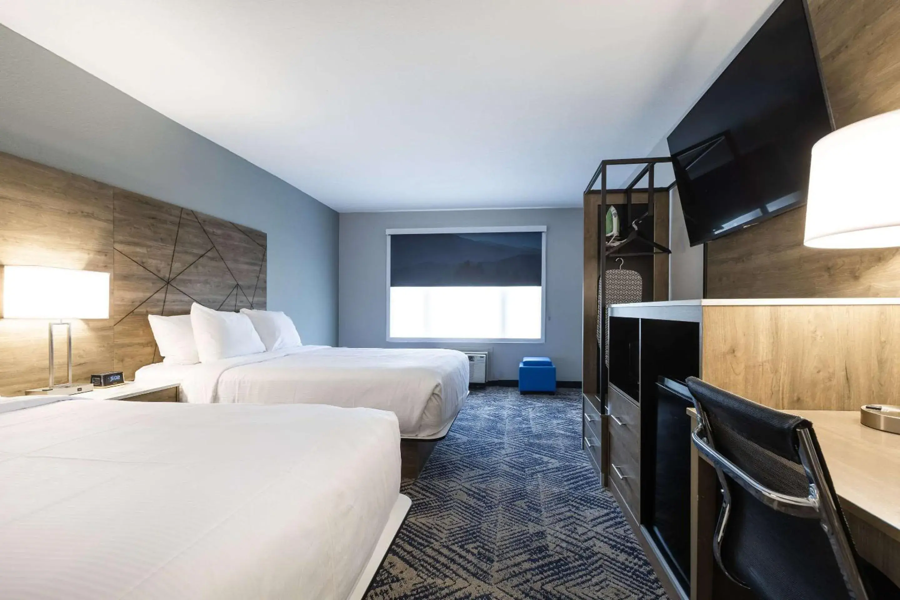 Bedroom, Bed in Rodeway Inn & Suites near Outlet Mall - Asheville Bedroom, Bed in Rodeway Inn & Suites near Outlet Mall - Asheville