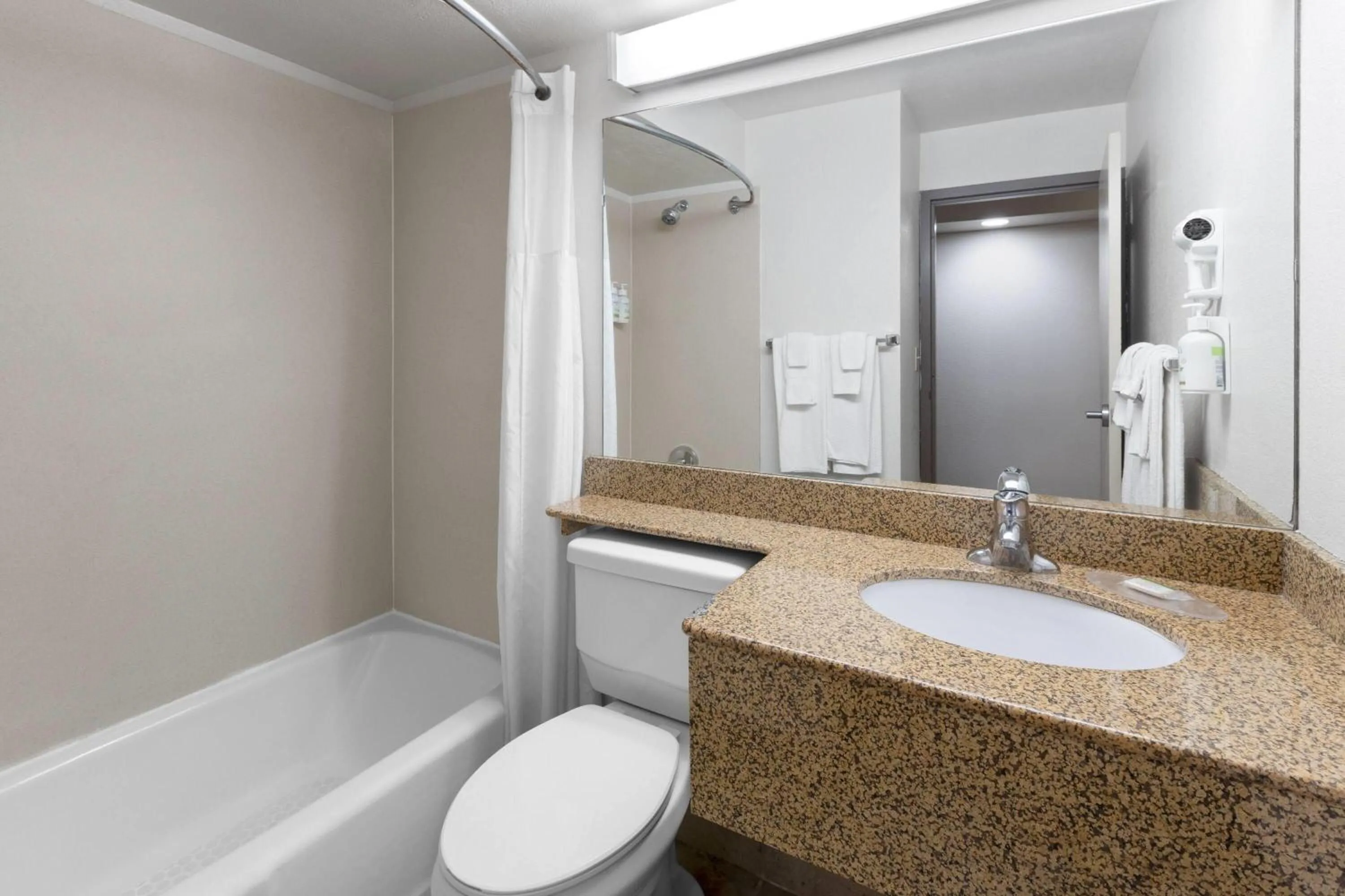 Bathroom in Baymont by Wyndham Jamestown Conference Center & Water Park