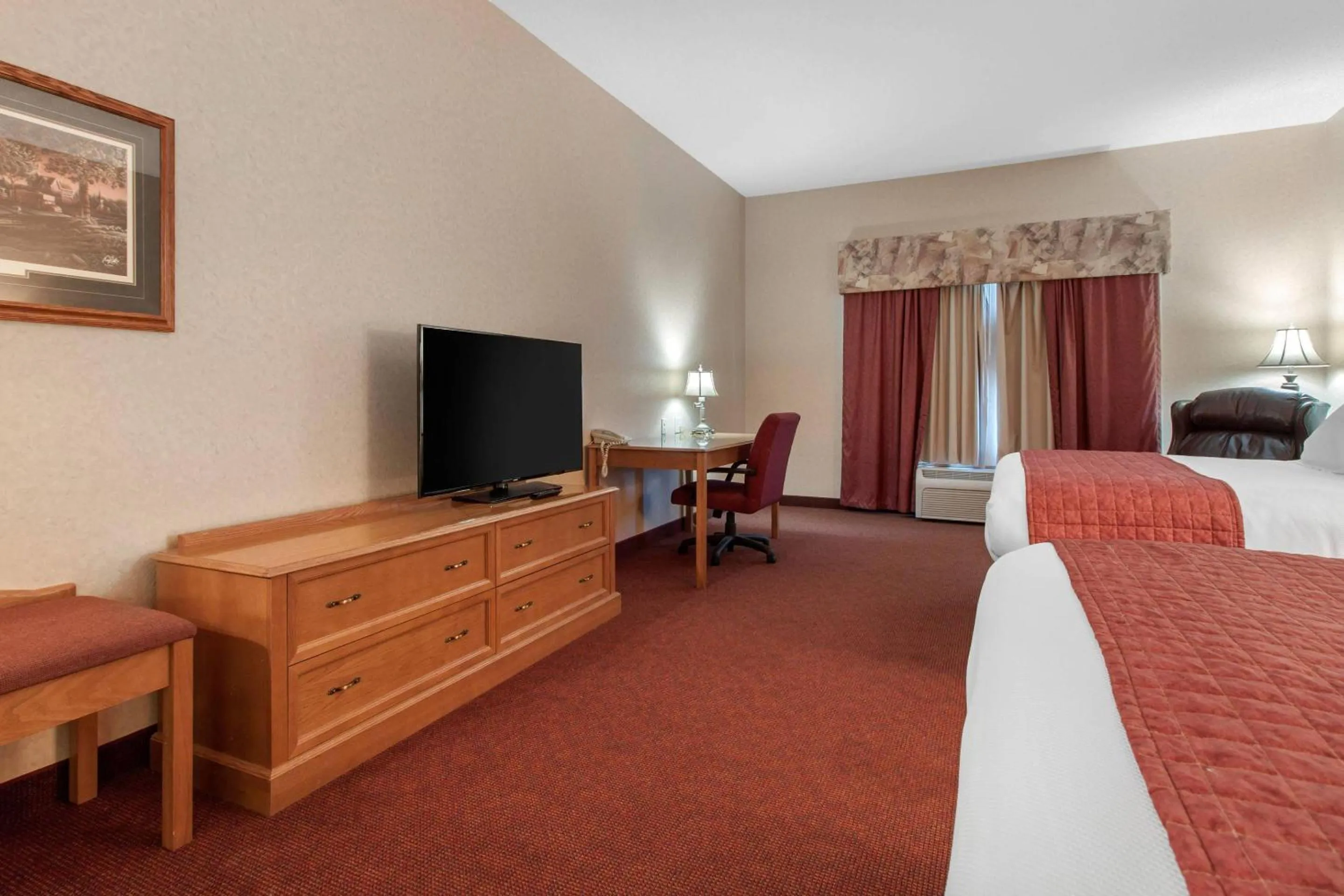 Queen Room with Two Queen Beds and Pool View - Non-Smoking in Norfolk Lodge & Suites, an Ascend Collection Hotel