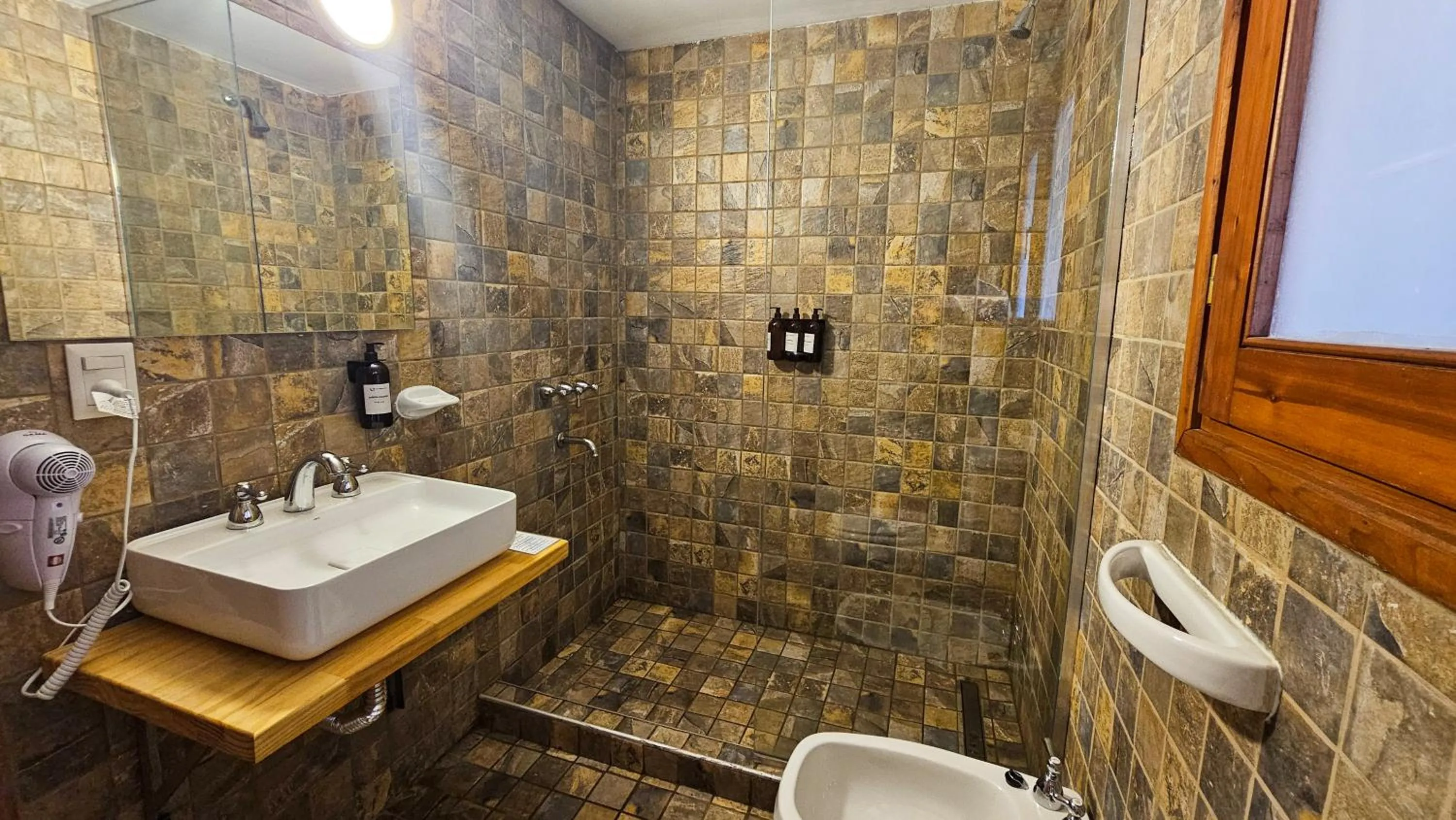 Bathroom in Pioneros Suites by Grupo Tierra Gaucha