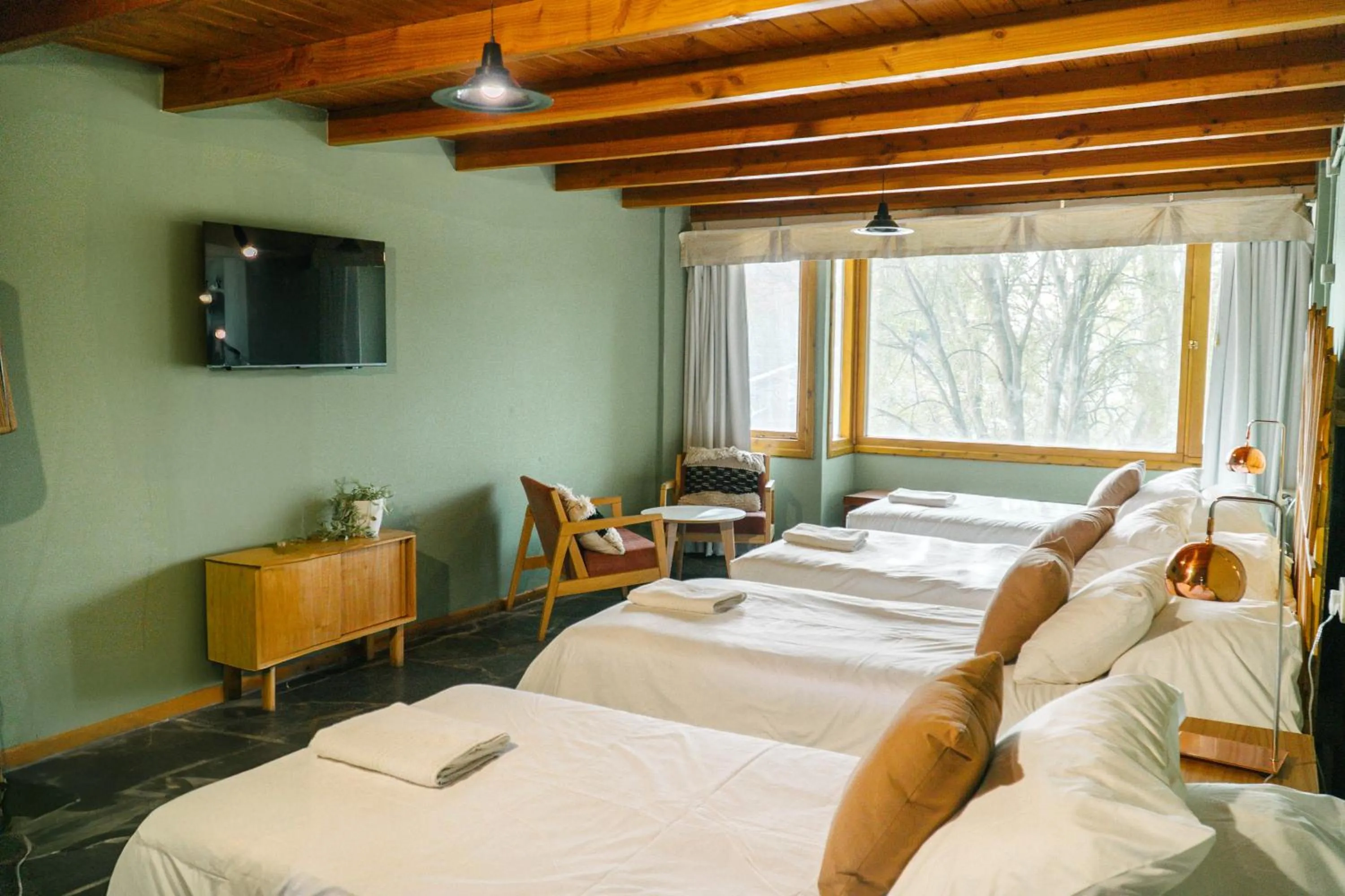 Bed in Pioneros Suites by Grupo Tierra Gaucha