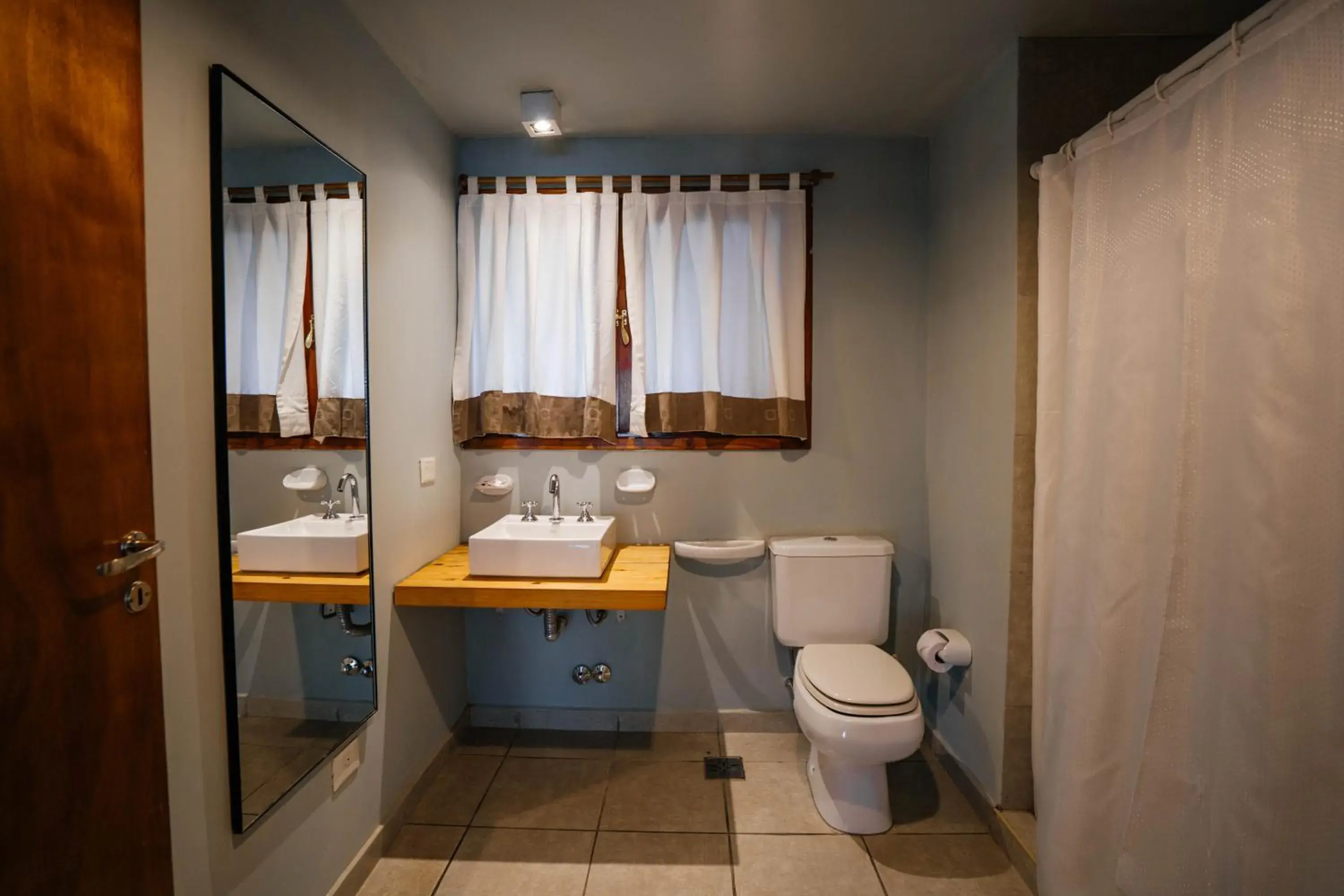 Bathroom in Pioneros Suites by Grupo Tierra Gaucha Bathroom in Pioneros Suites by Grupo Tierra Gaucha