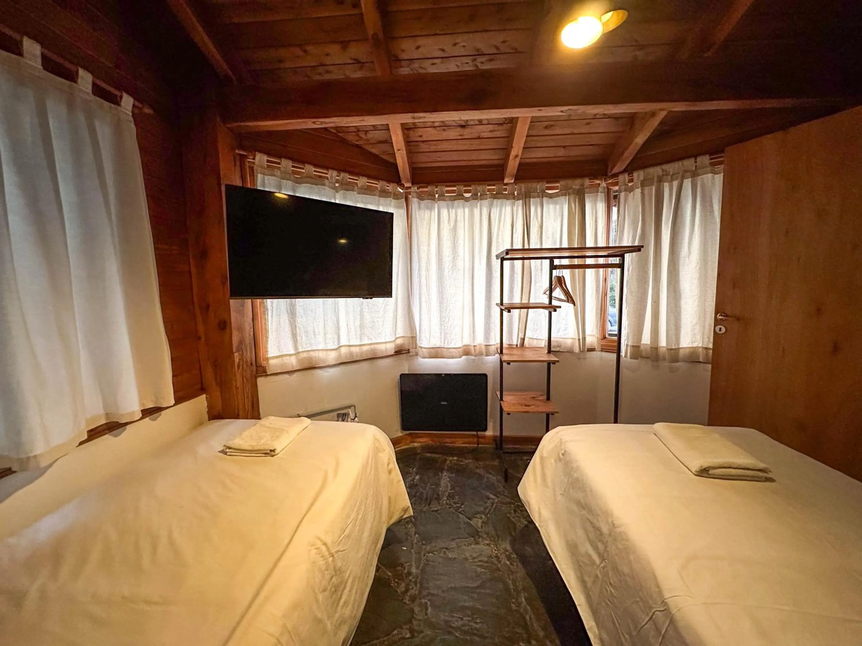 Bedroom, Bed in Pioneros Suites by Grupo Tierra Gaucha