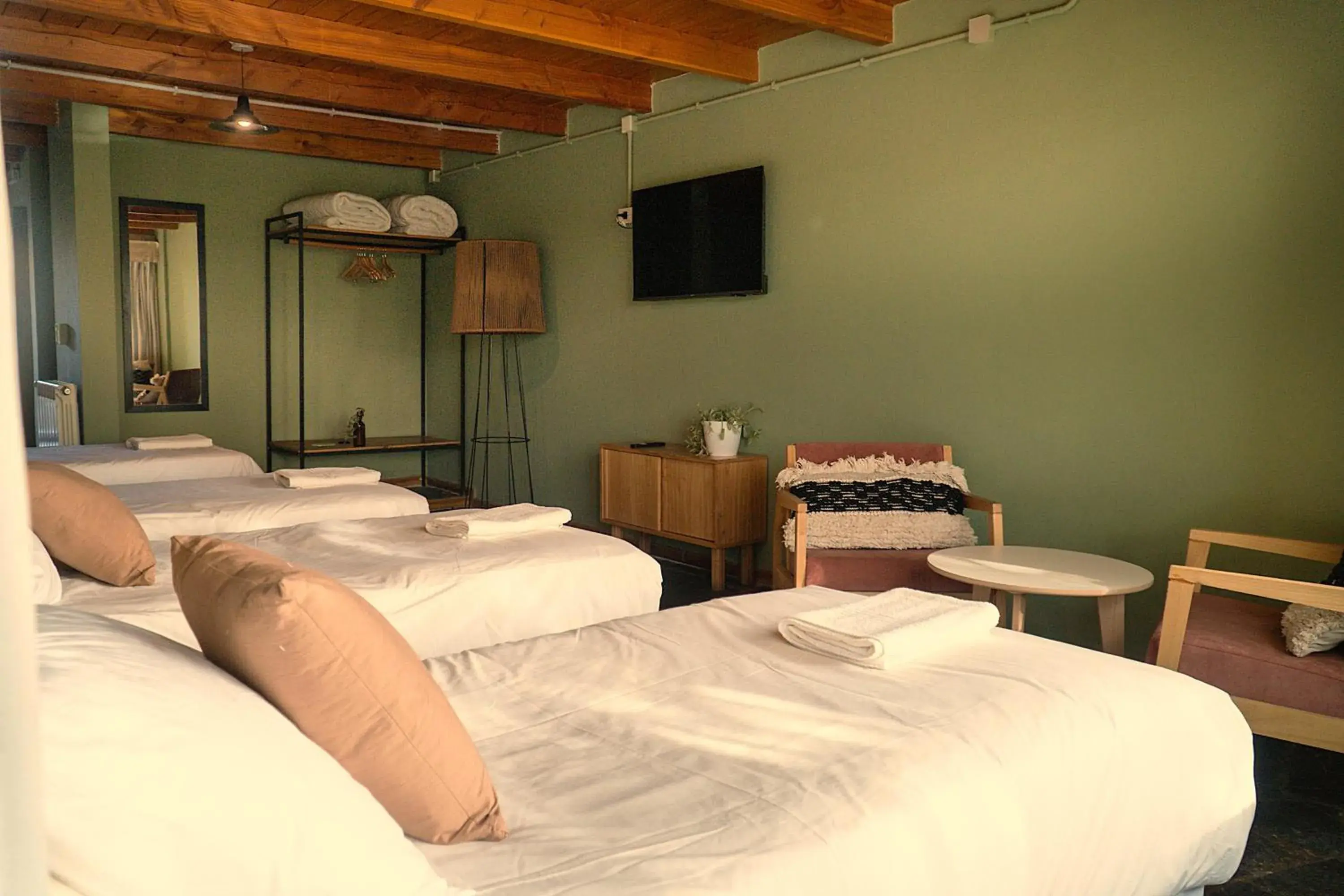 Quadruple Room in Pioneros Suites by Grupo Tierra Gaucha Quadruple Room in Pioneros Suites by Grupo Tierra Gaucha