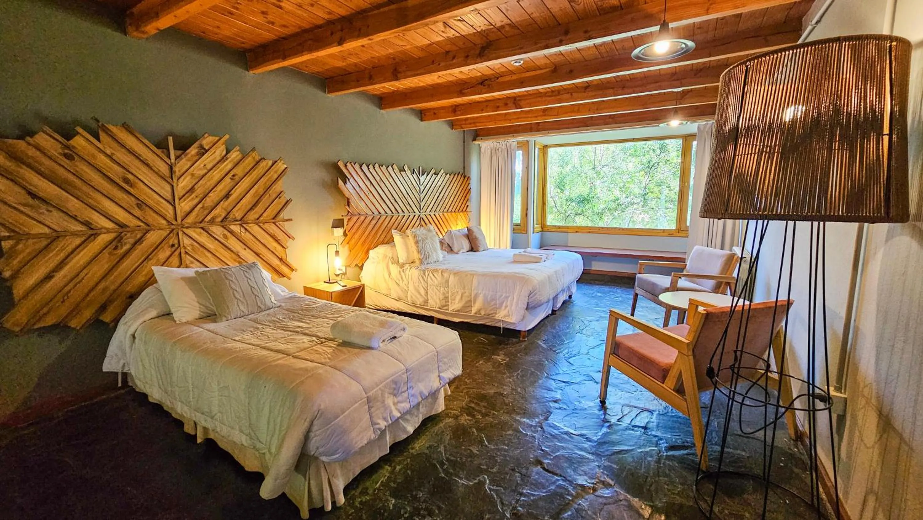 Bed in Pioneros Suites by Grupo Tierra Gaucha