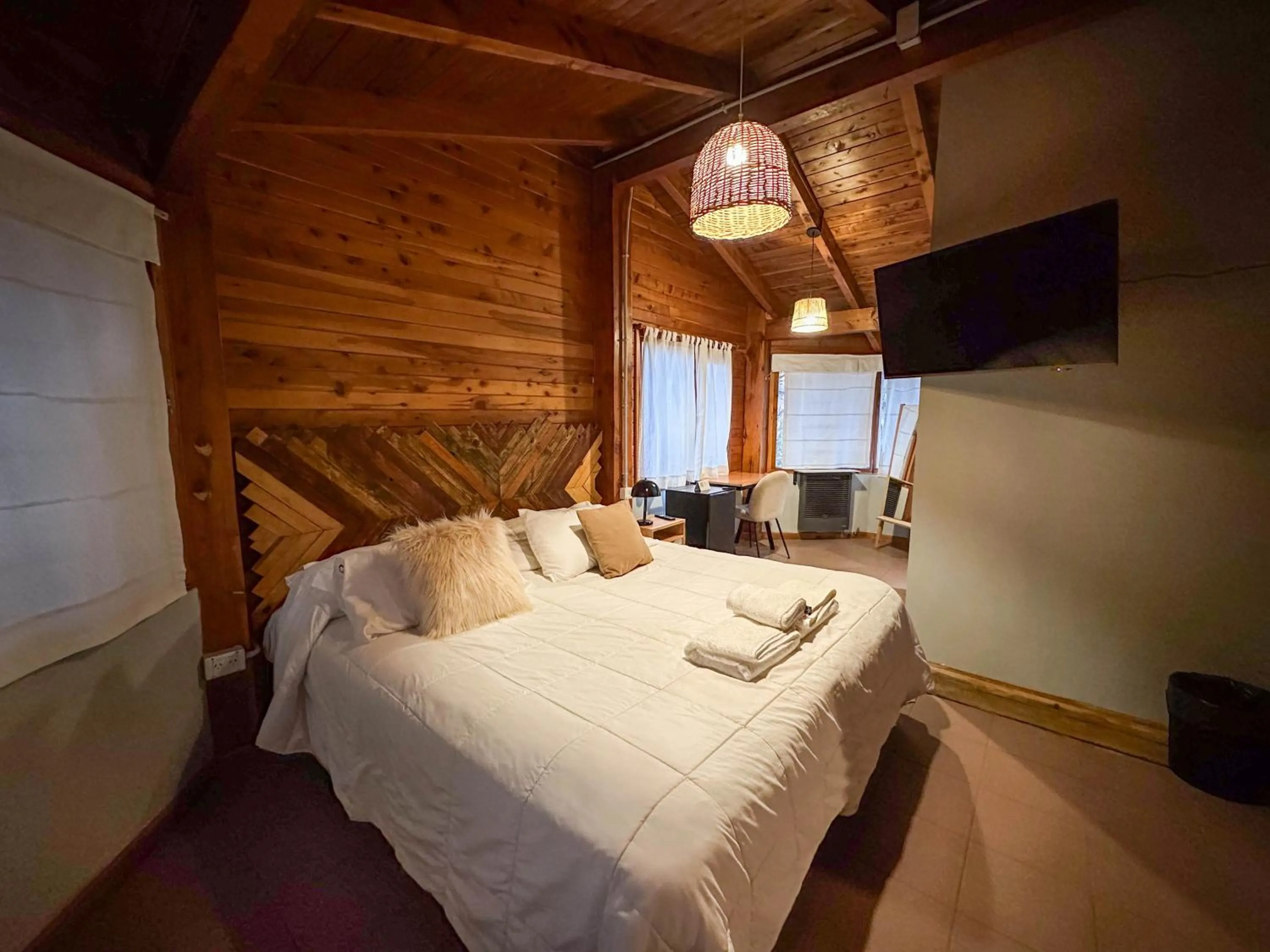 Bed in Pioneros Suites by Grupo Tierra Gaucha