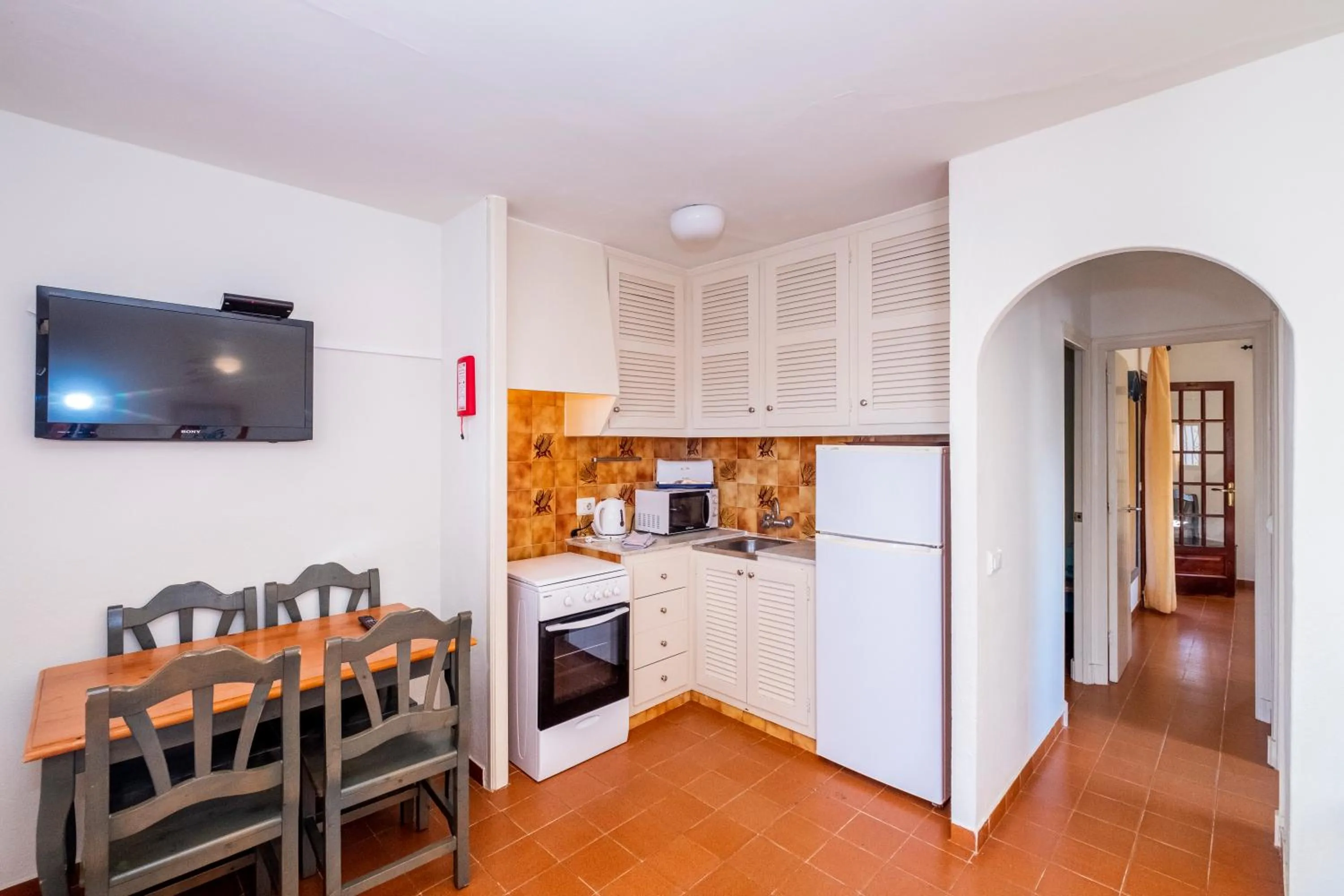 Kitchen or kitchenette in Apartamentos Son Bou Gardens By MENORCARENTALS