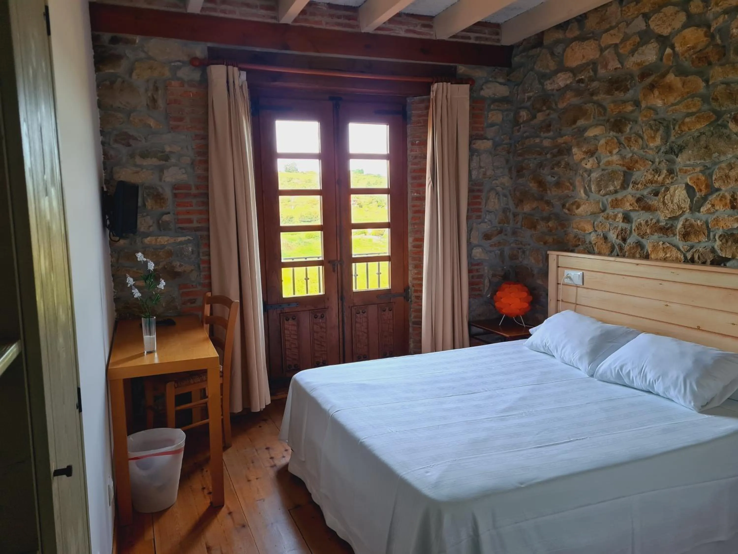 Photo of the whole room, Bed in Hospederia Santillana