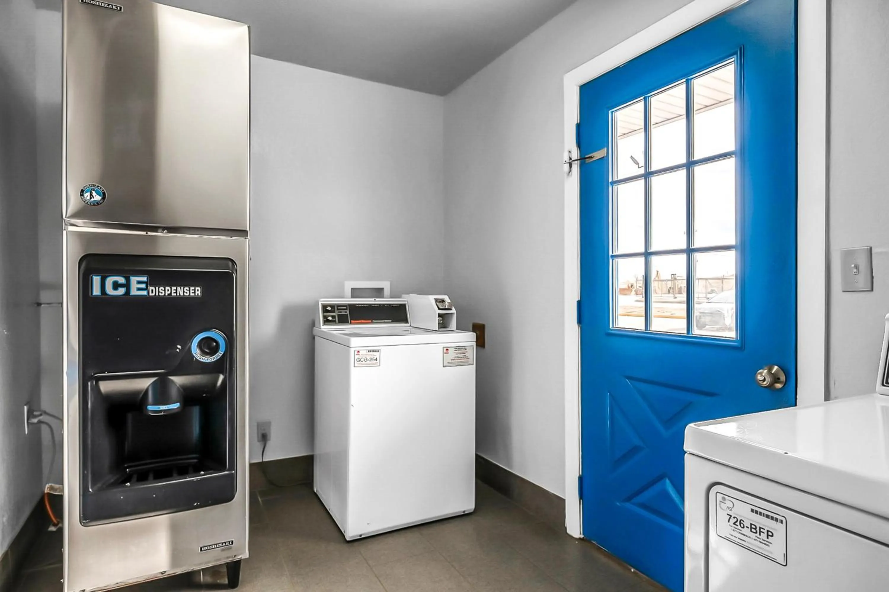 washing machine in SureStay Hotel by Best Western Oklahoma City West