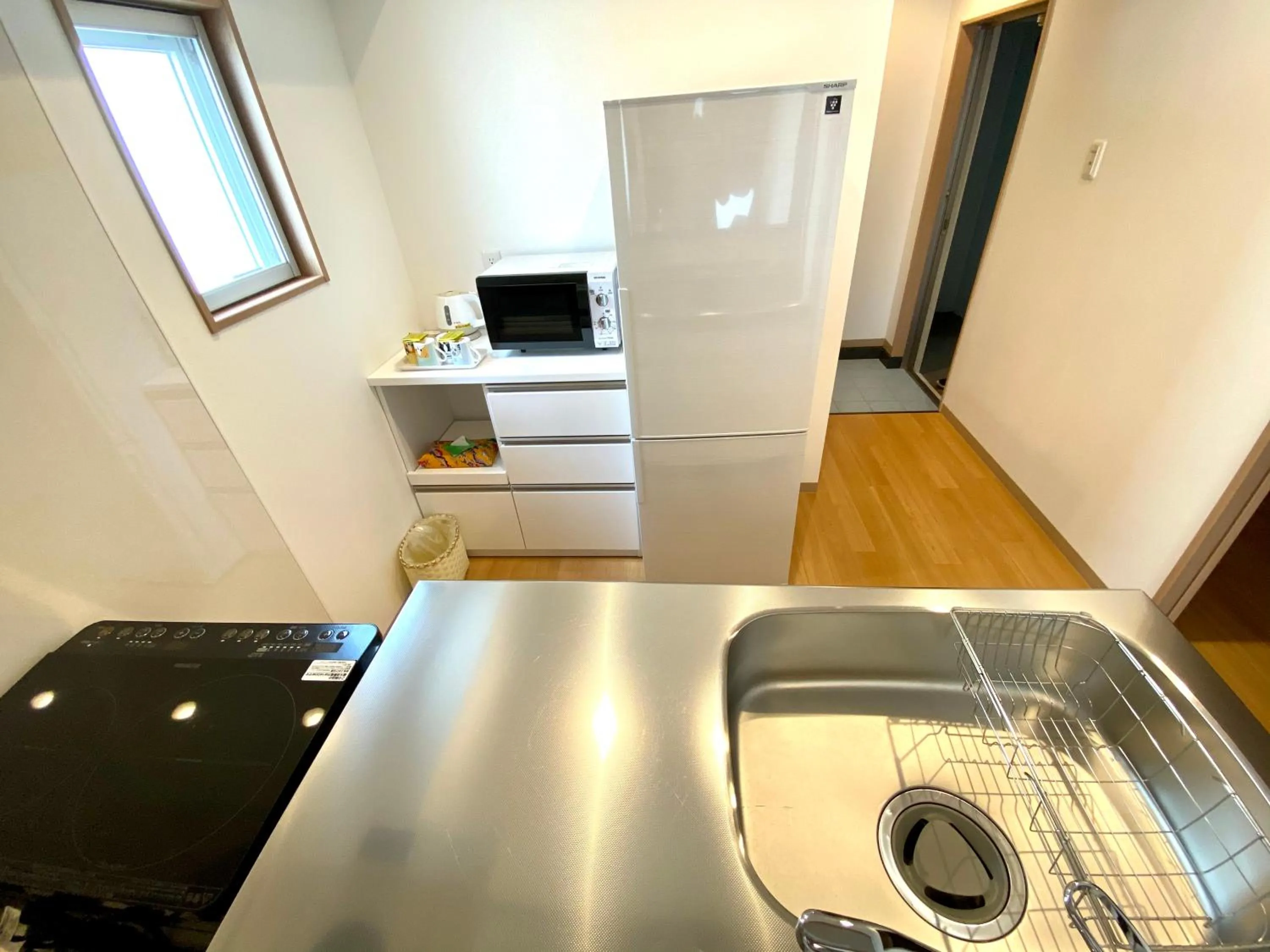Kitchen or kitchenette in M´s Stay Okinawa