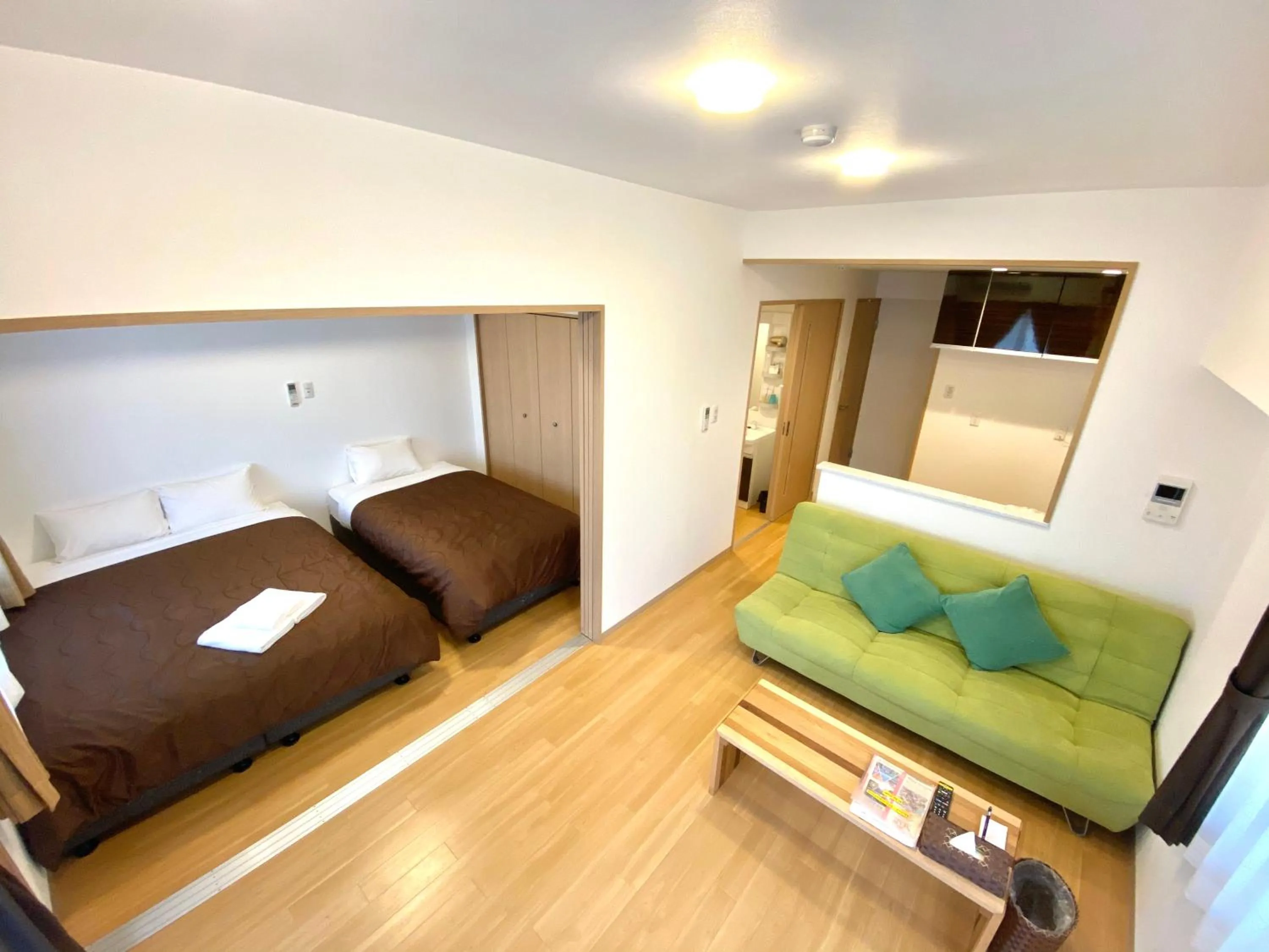 Photo of the whole room, Bed in M´s Stay Okinawa