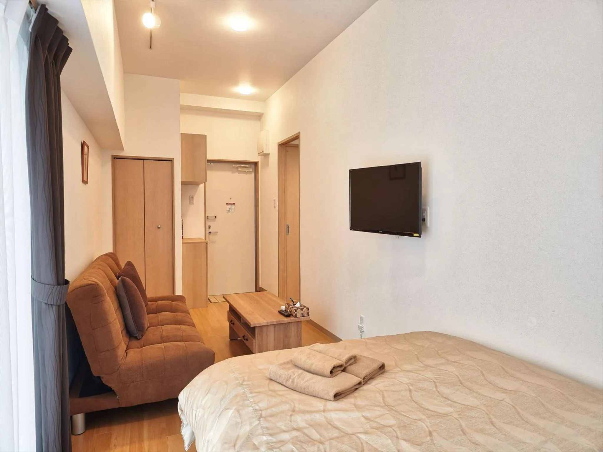 Photo of the whole room, Bed in M´s Stay Okinawa