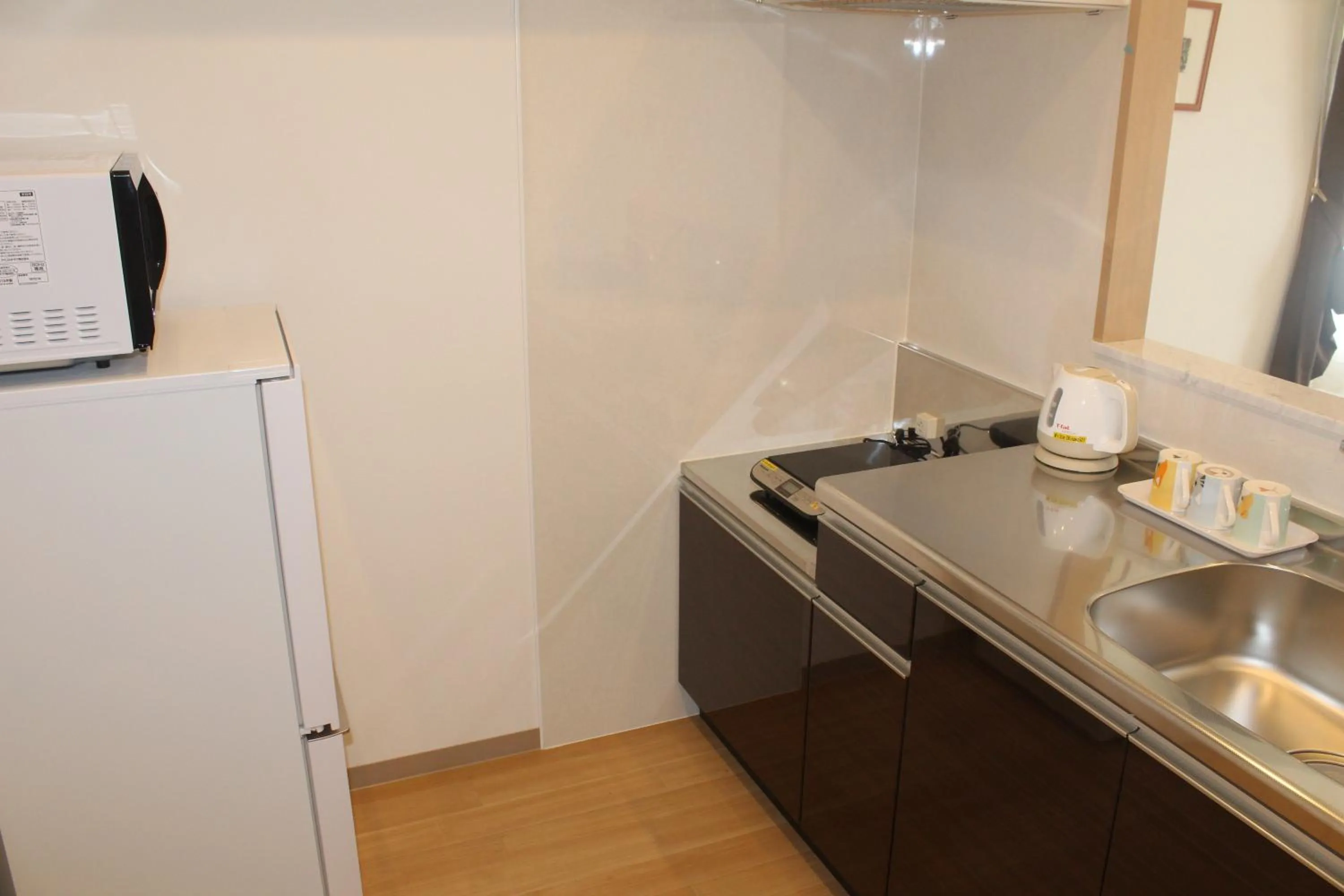Kitchen or kitchenette in M´s Stay Okinawa