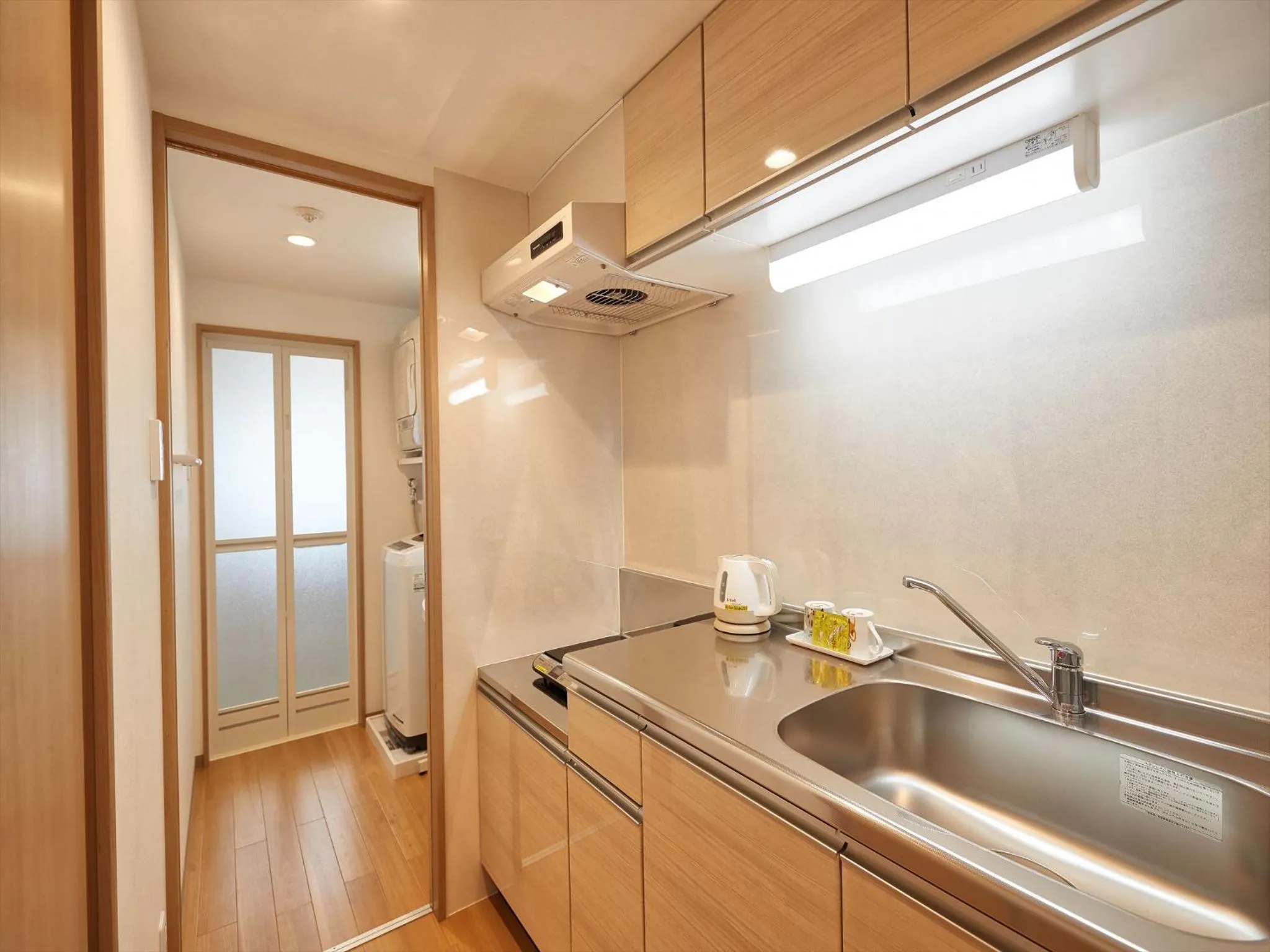 Kitchen or kitchenette in M´s Stay Okinawa