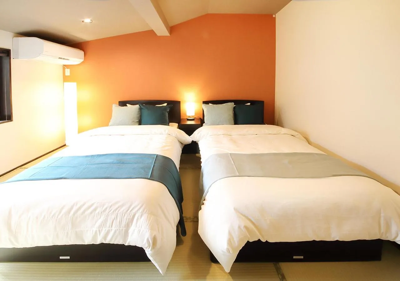 Property building, Bed in Guest House Nishijin Yui