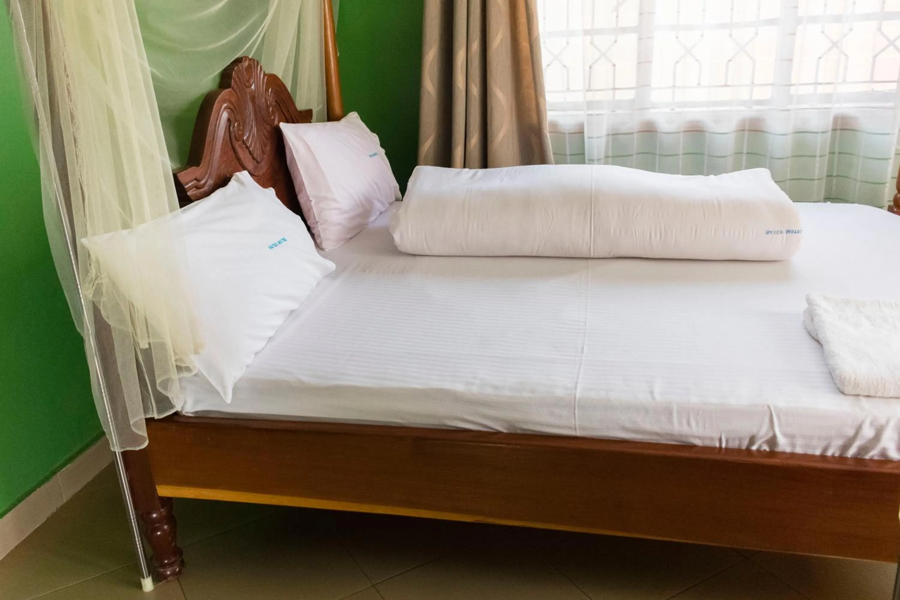 Photo of the whole room, Bed in Rates Motel Mbale