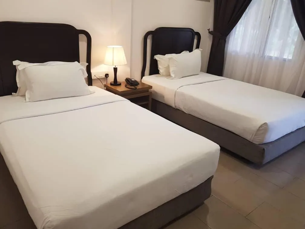 Bed in Lotus Seaview Beach Resort, Pengerang