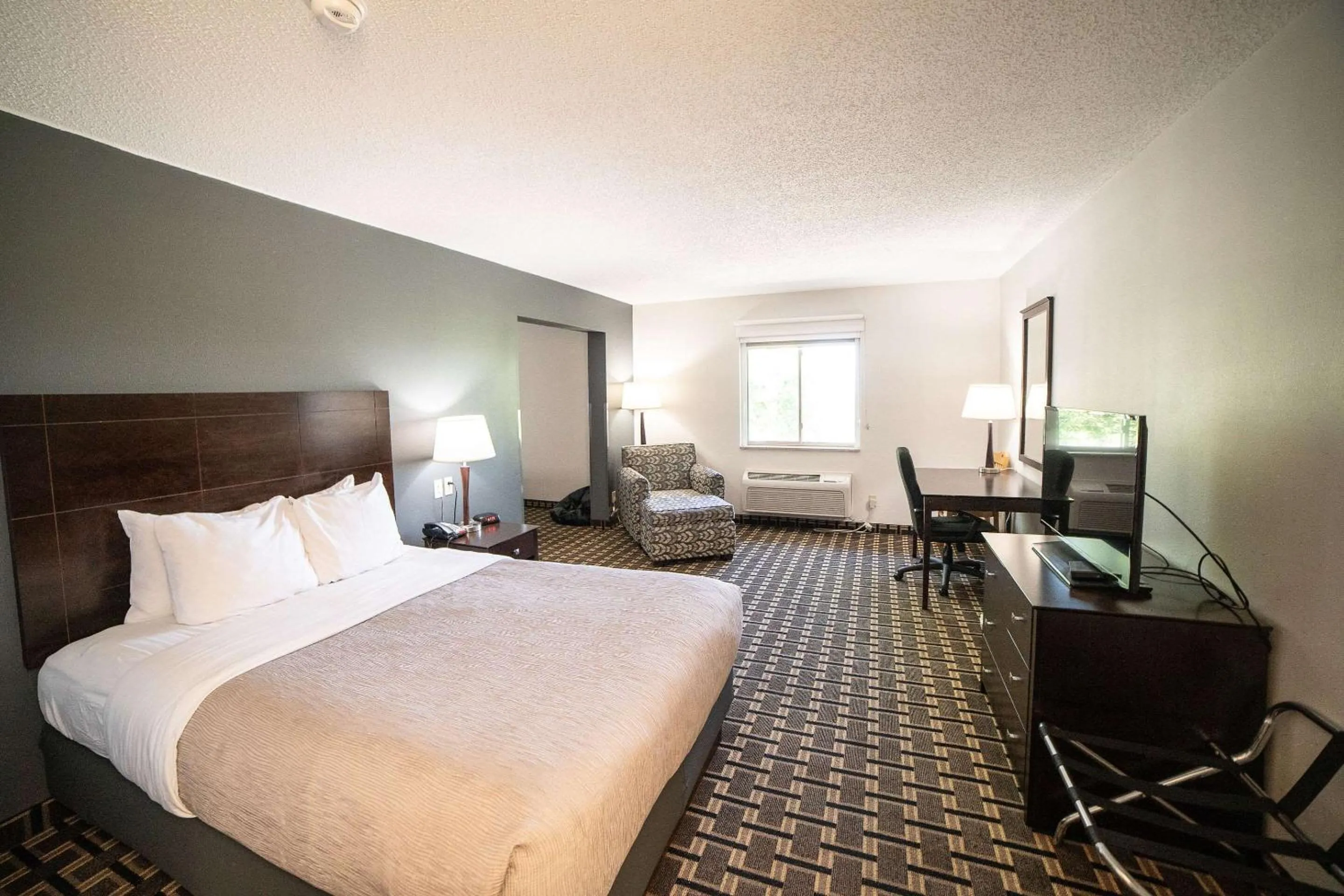 Bedroom, Bed in Quality Inn & Suites Watertown near Prairie Lakes Ice Arena