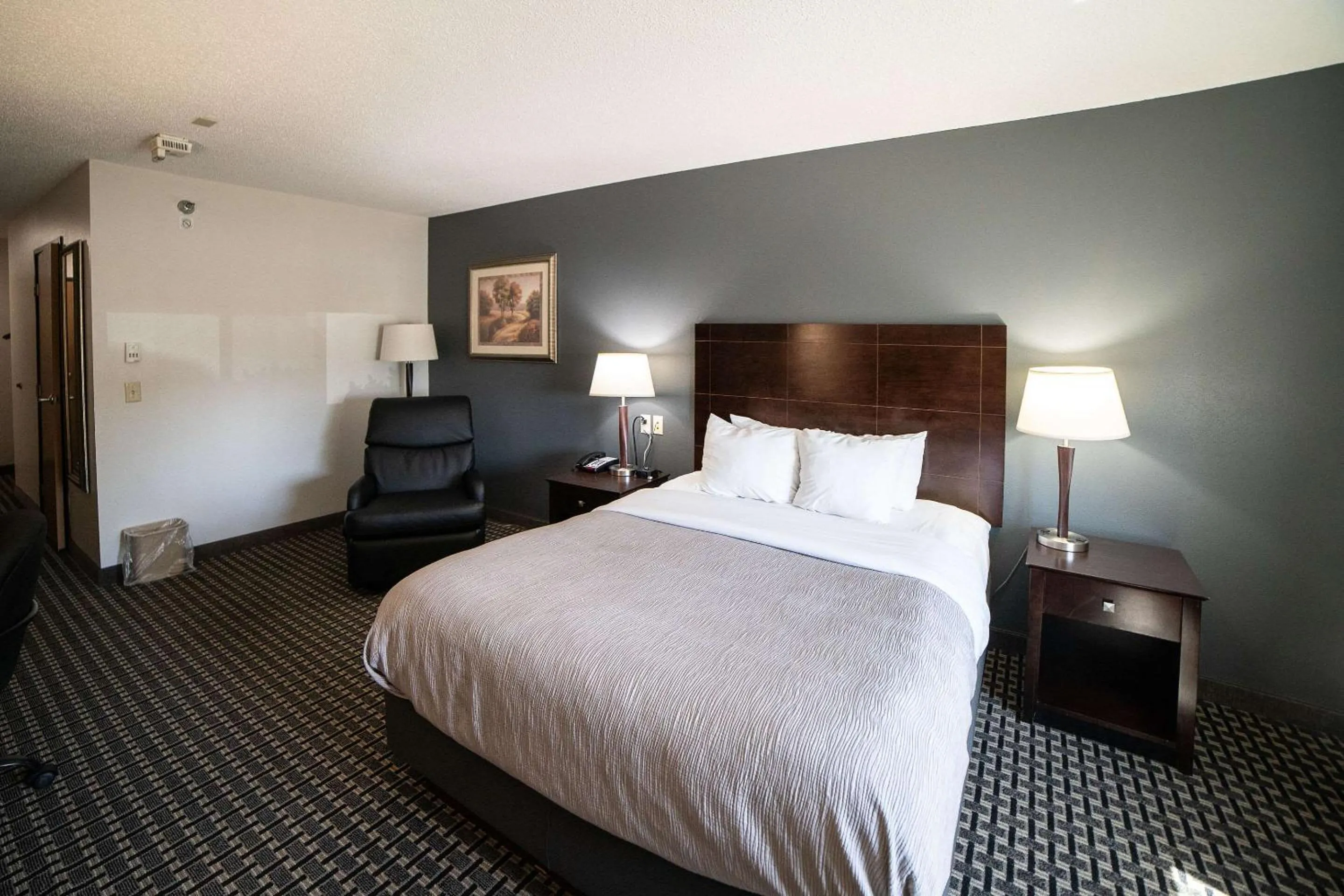 Bedroom, Bed in Quality Inn & Suites Watertown near Prairie Lakes Ice Arena