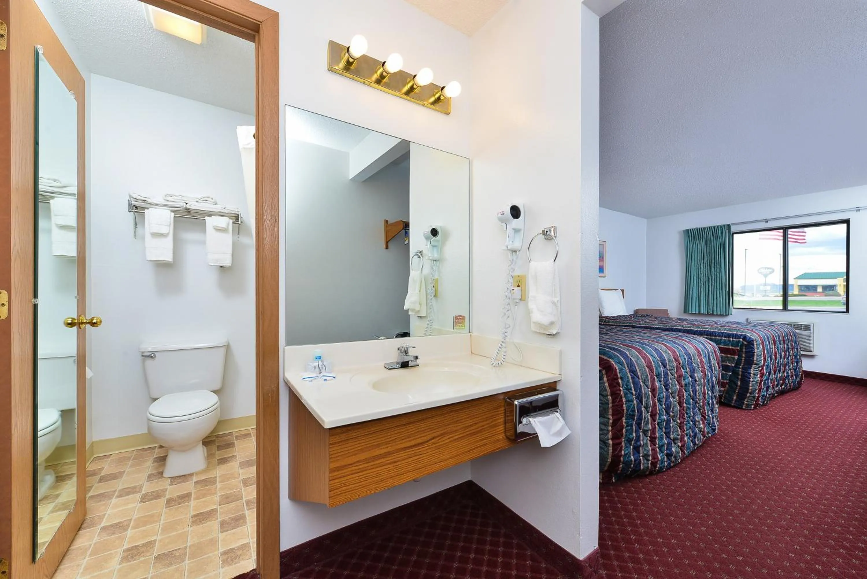 Bathroom, Bed in Travelodge by Wyndham Spearfish