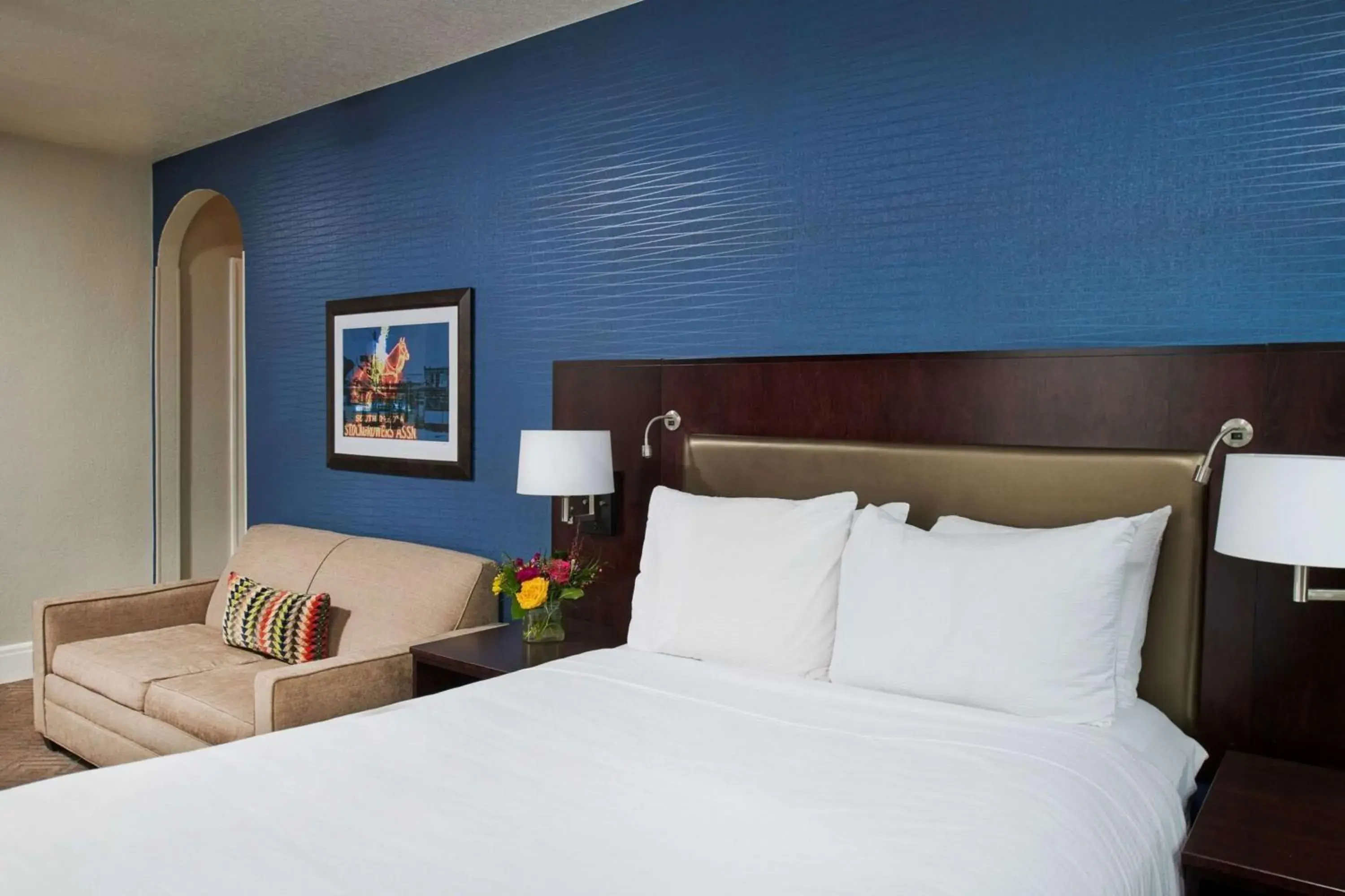 Living room, Bed in Hotel Alex Johnson Rapid City, Curio Collection by Hilton Living room, Bed in Hotel Alex Johnson Rapid City, Curio Collection by Hilton