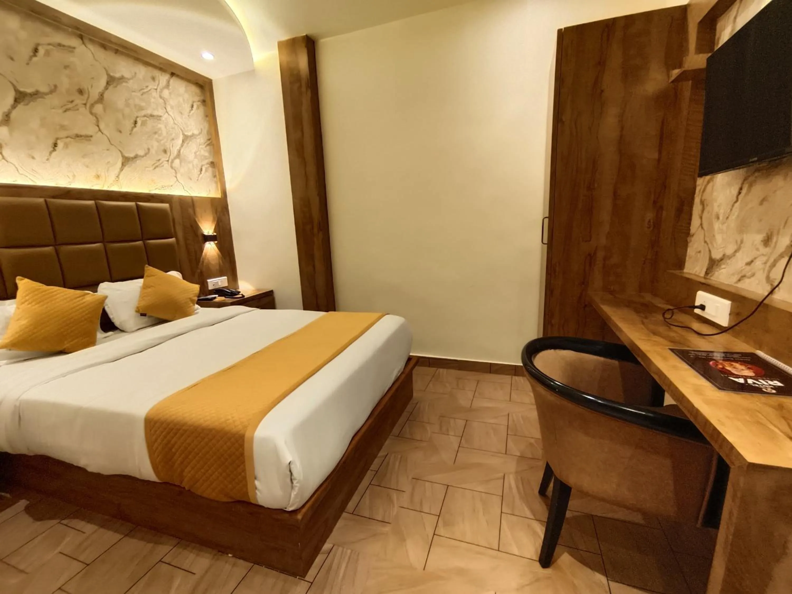 Bed in Hotel Riva International Goregaon- Near NESCO