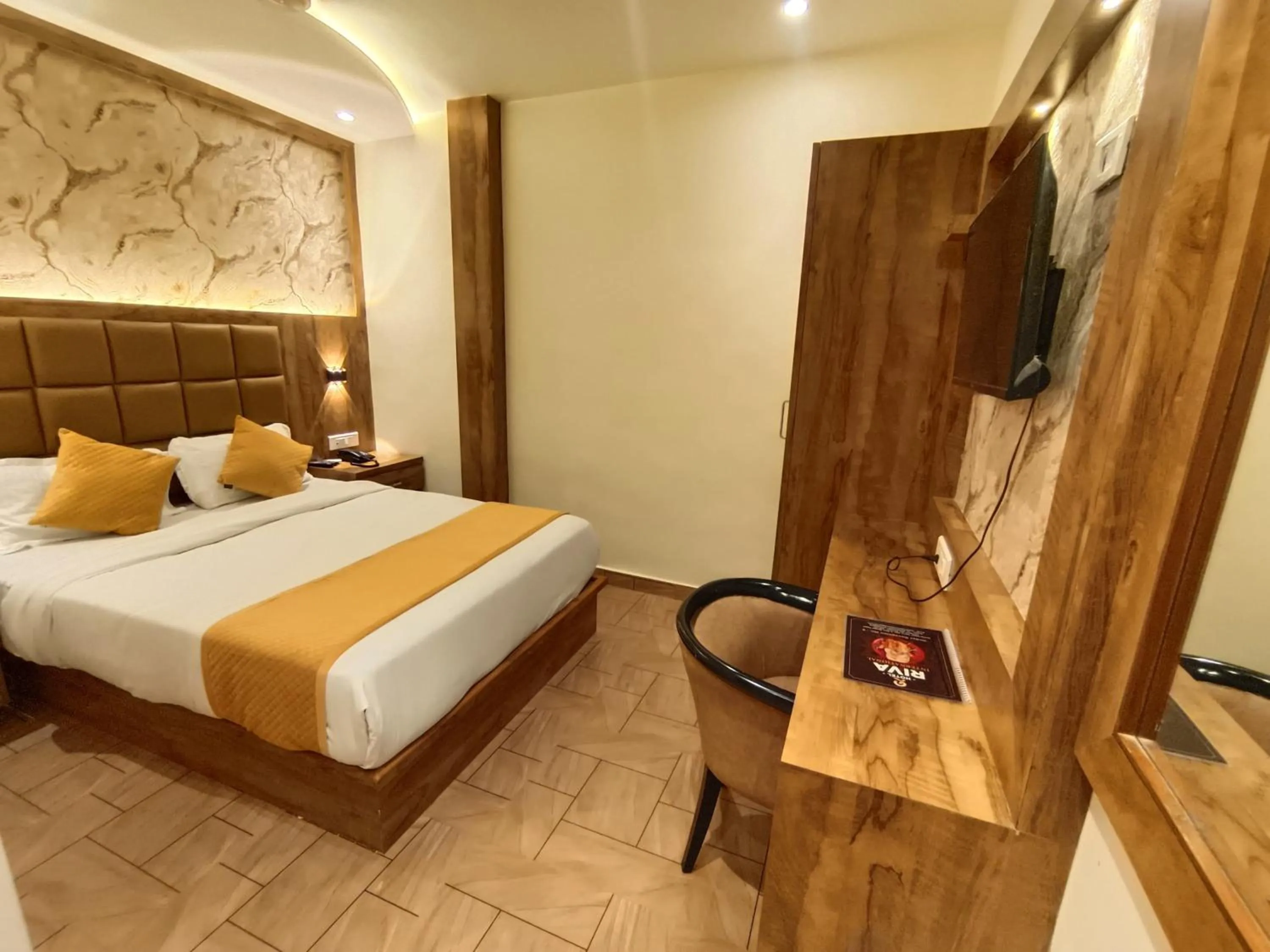 Bed in Hotel Riva International Goregaon- Near NESCO