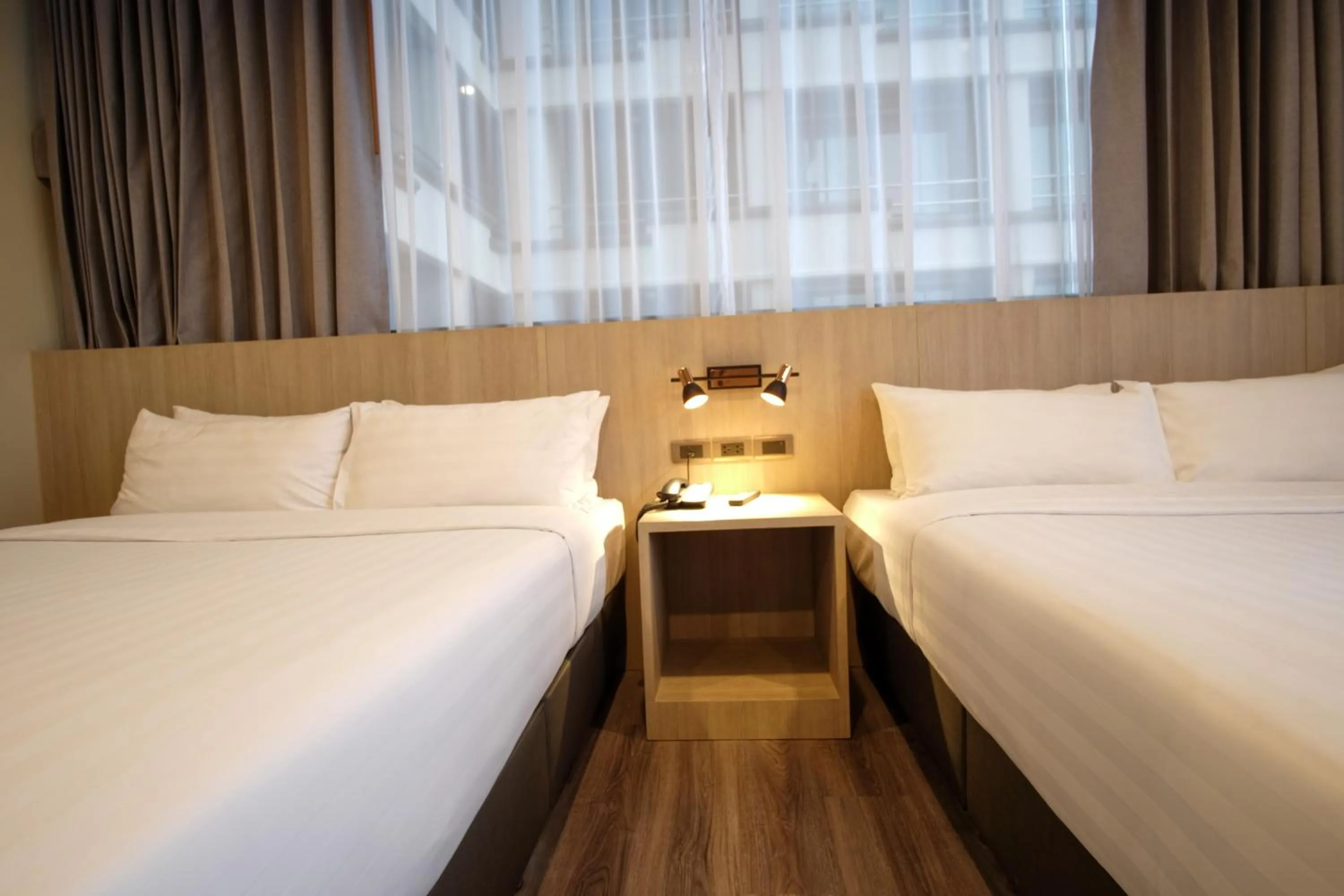 Bed in Gold Orchid Bangkok Hotel