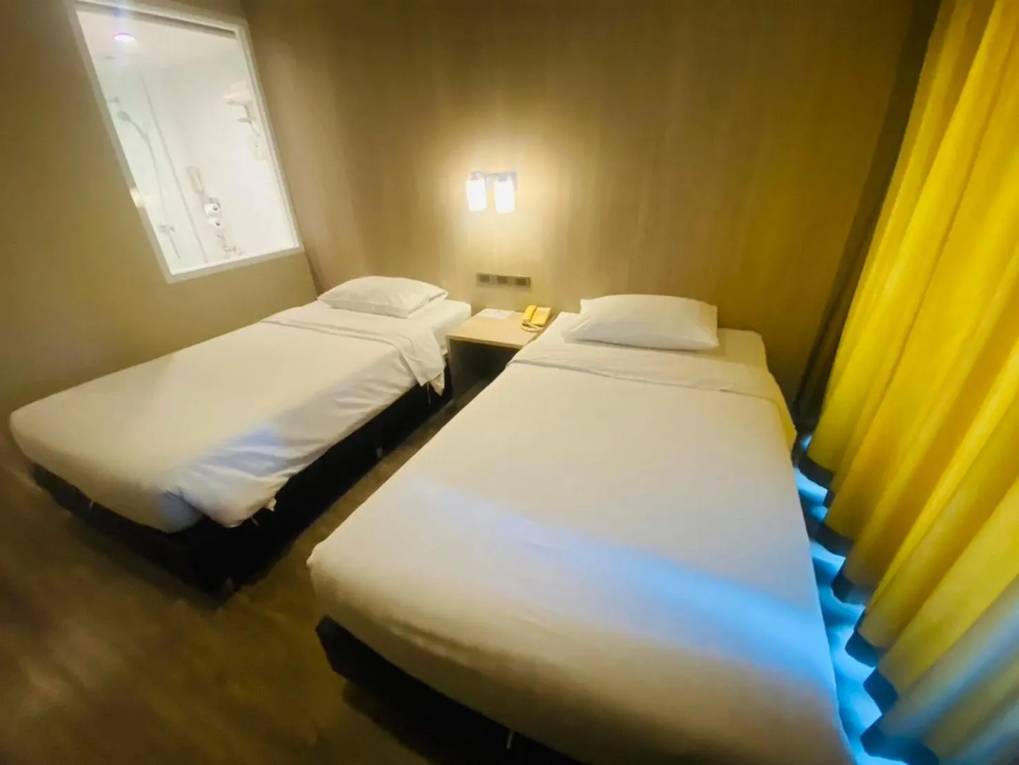 Bed in Gold Orchid Bangkok Hotel