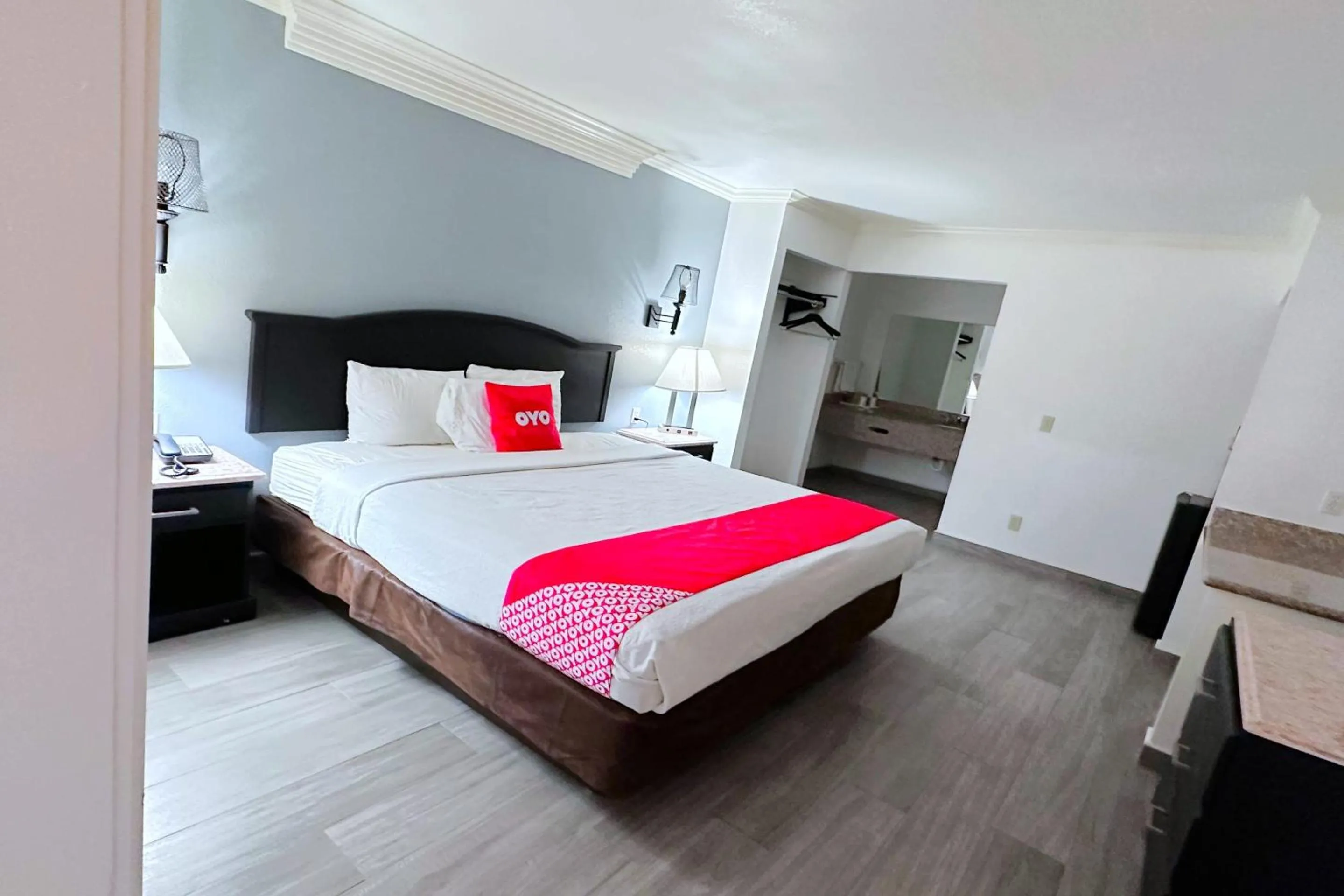 Bedroom, Bed in Three Rivers Executive Inn & Suites By OYO