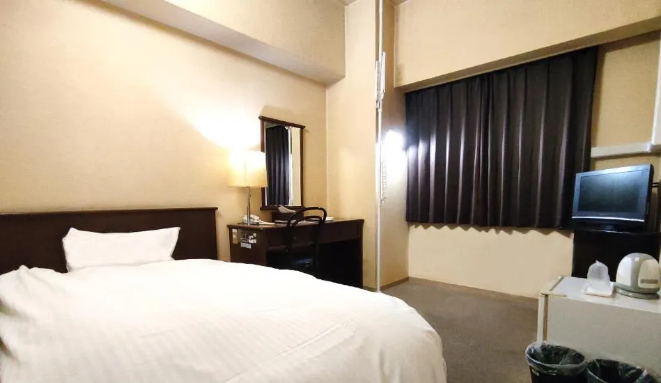 Bed in Hotel New Century Sakaide