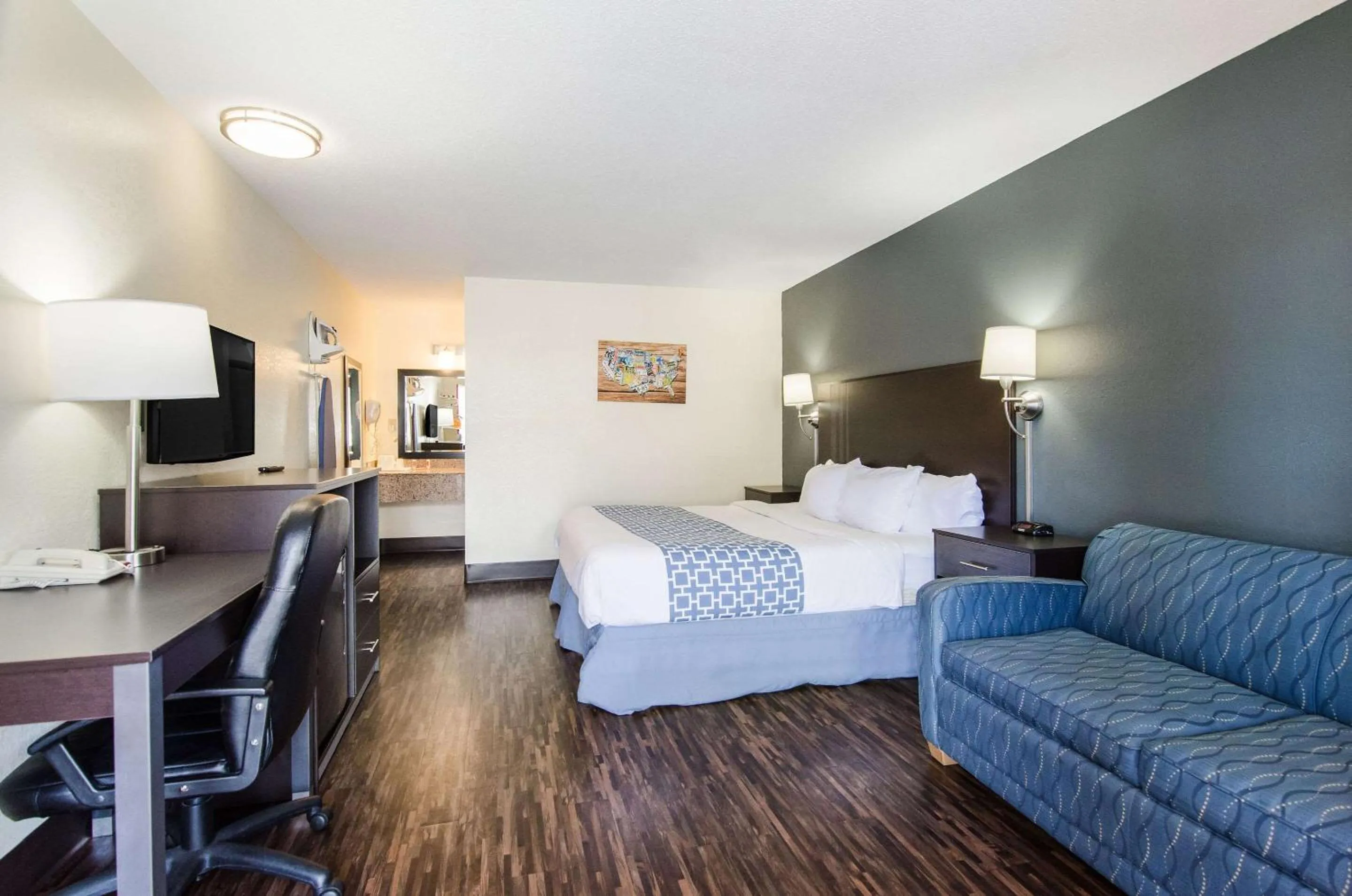 Photo of the whole room, Bed in Econo Lodge Near Motor Speedway