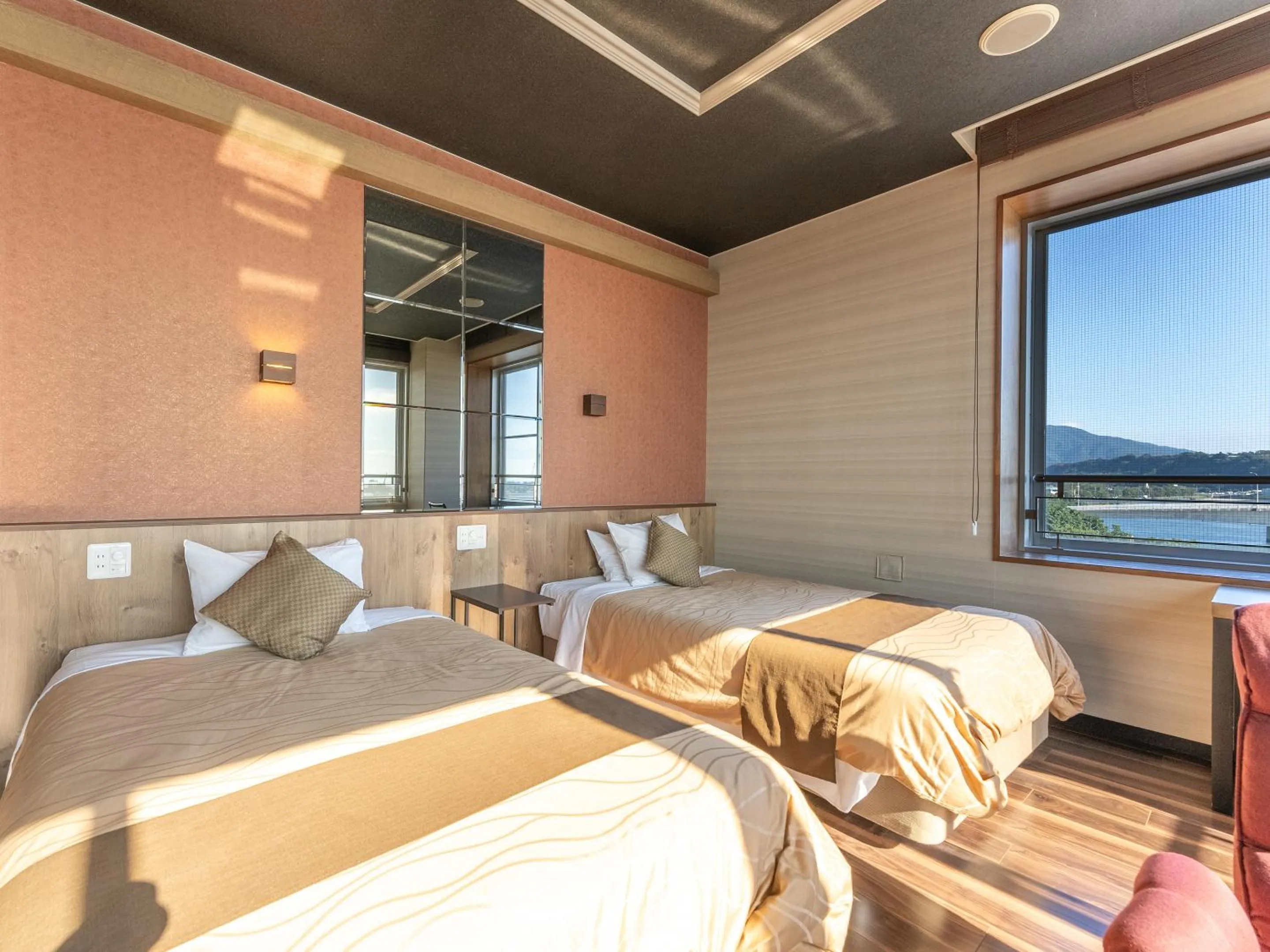 Bed in LiVEMAX RESORT Sakurajima Sea Front