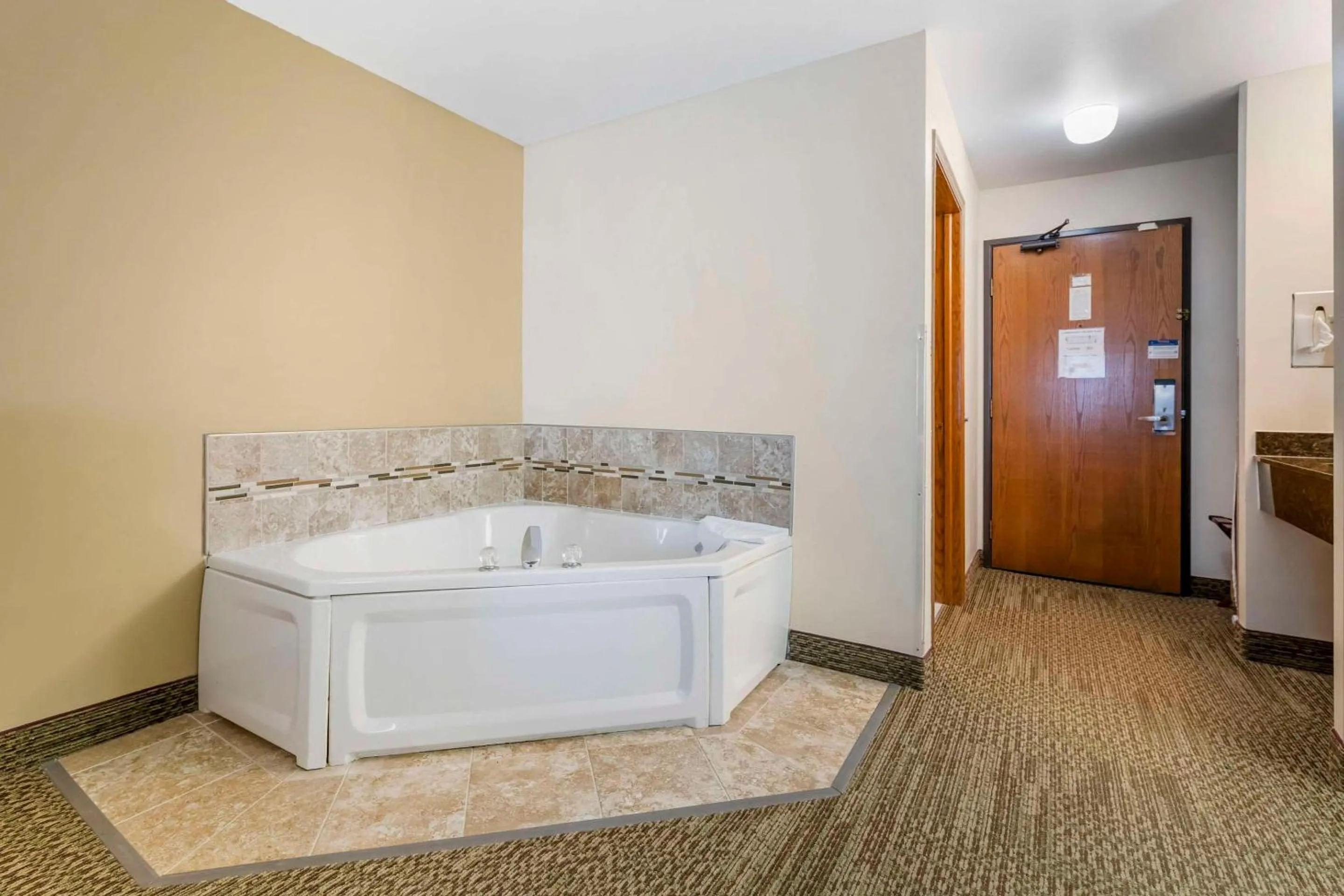 Bedroom in Quality Inn & Suites Stoughton - Madison South