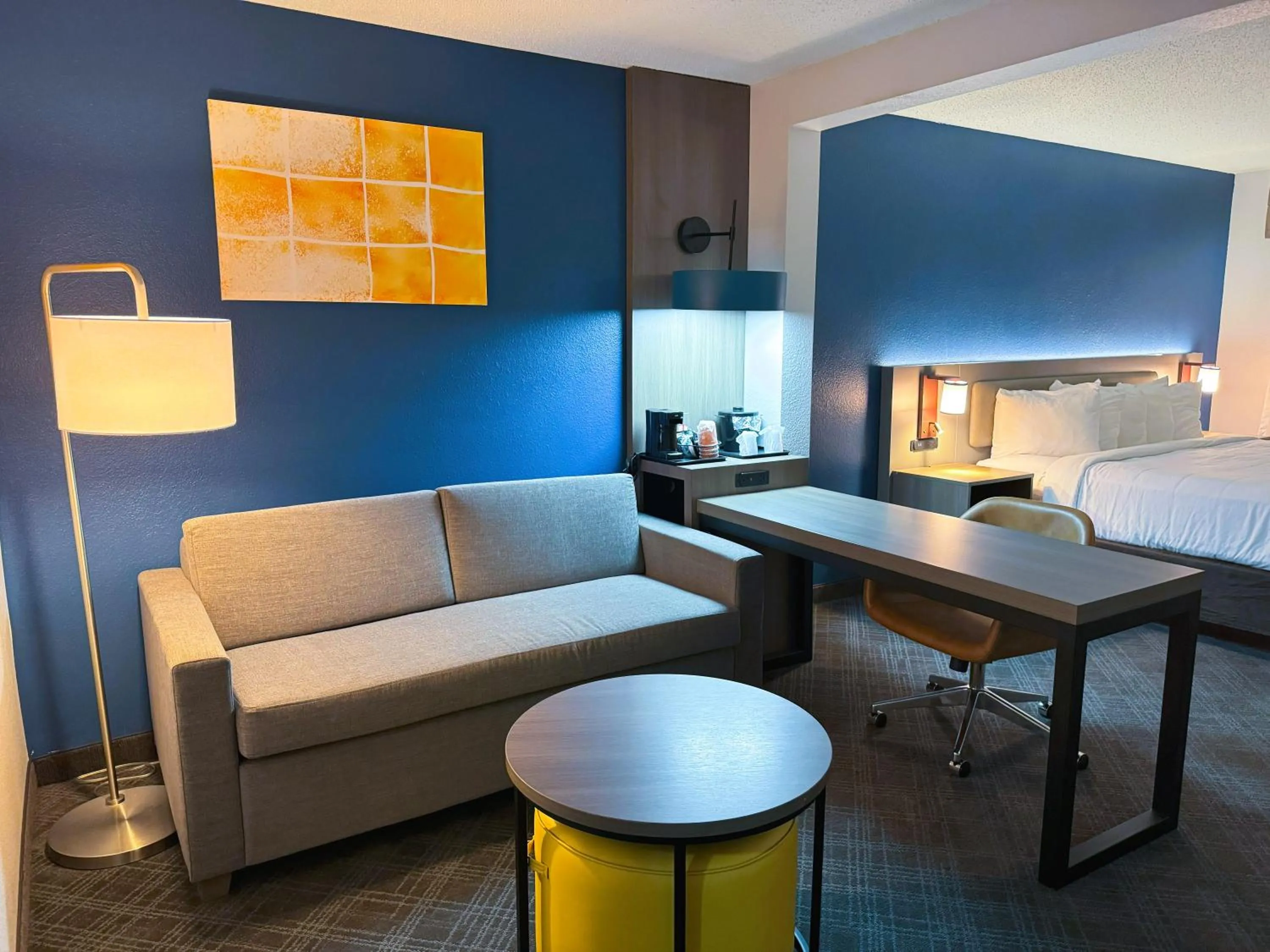 Seating area, Bed in Comfort Inn & Suites Sheboygan I-43