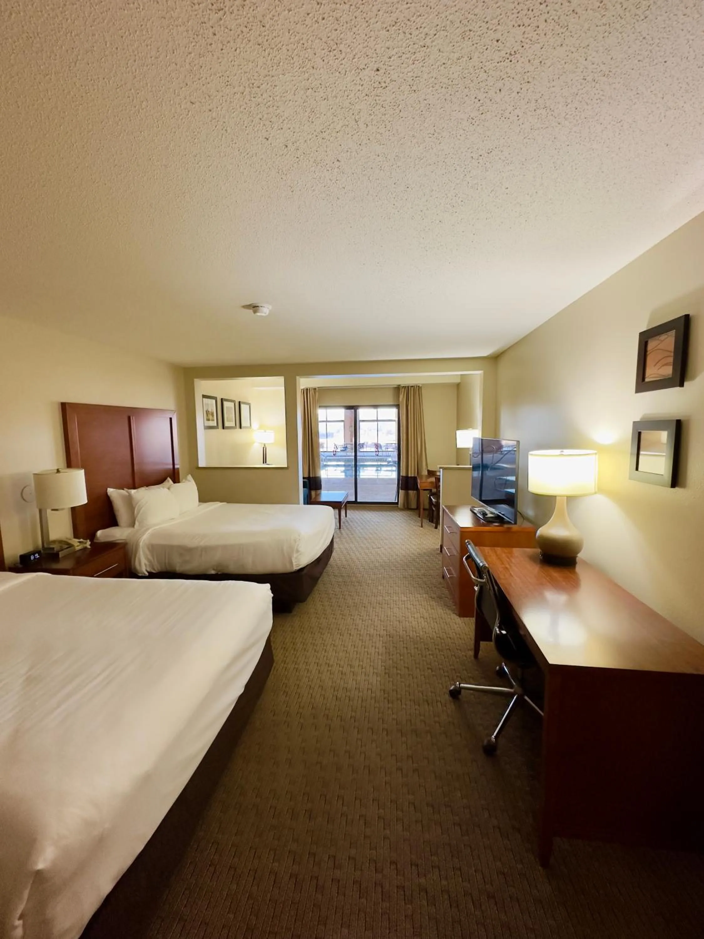 Communal lounge/ TV room, Bed in Comfort Inn & Suites Black River Falls I-94