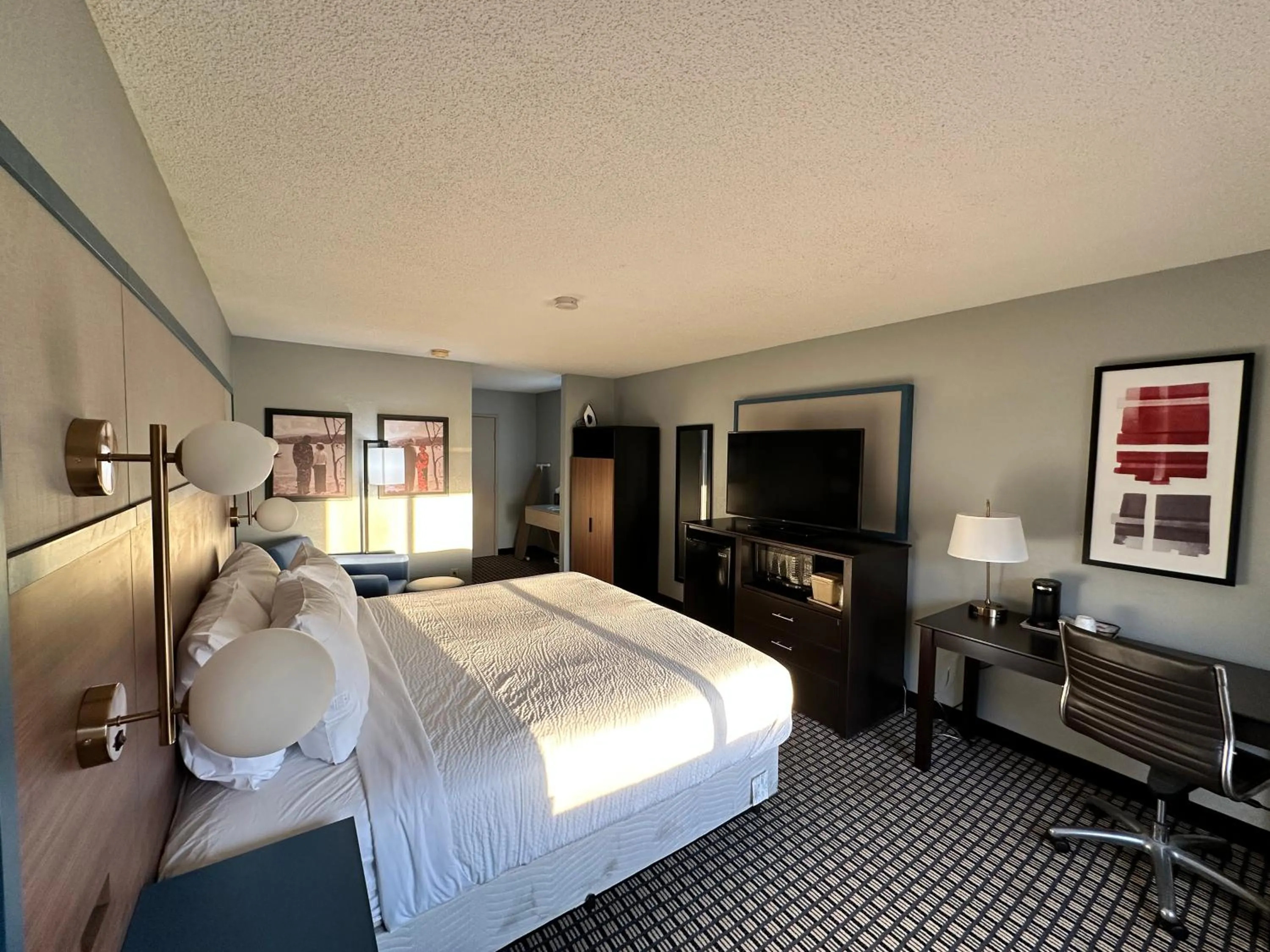 Bed in AmericInn by Wyndham Reedsburg