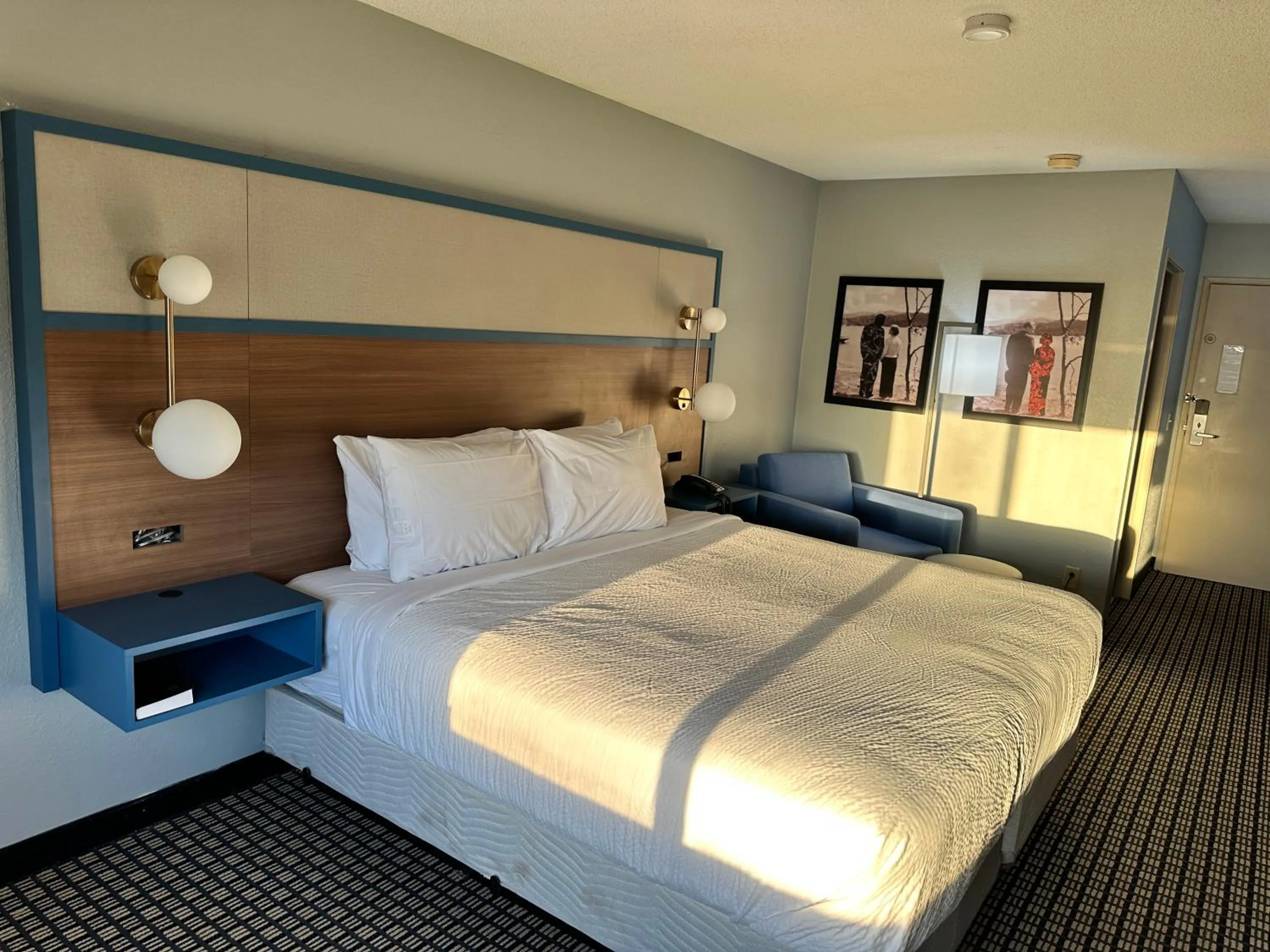 Bed in AmericInn by Wyndham Reedsburg