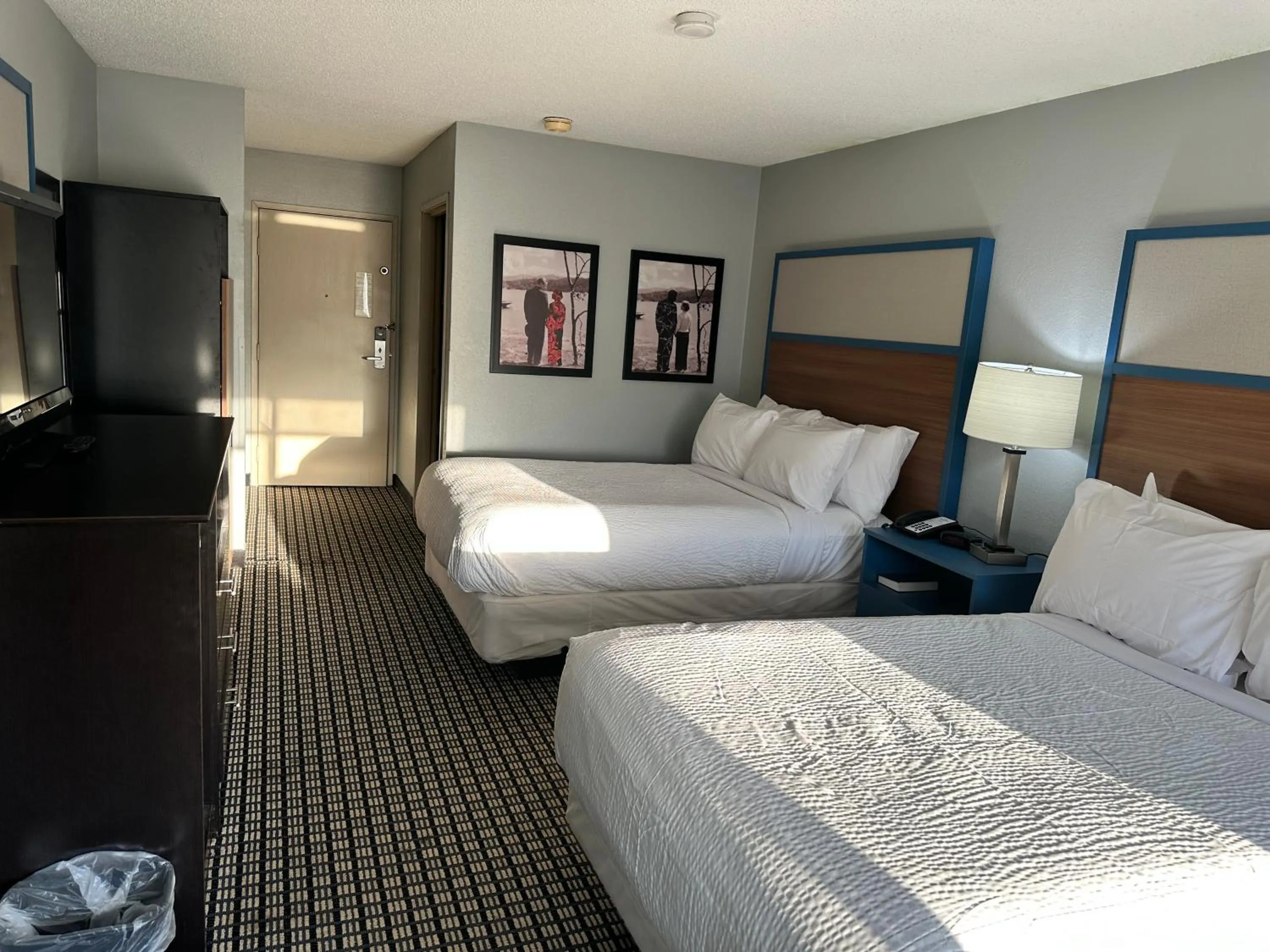 Bed in AmericInn by Wyndham Reedsburg