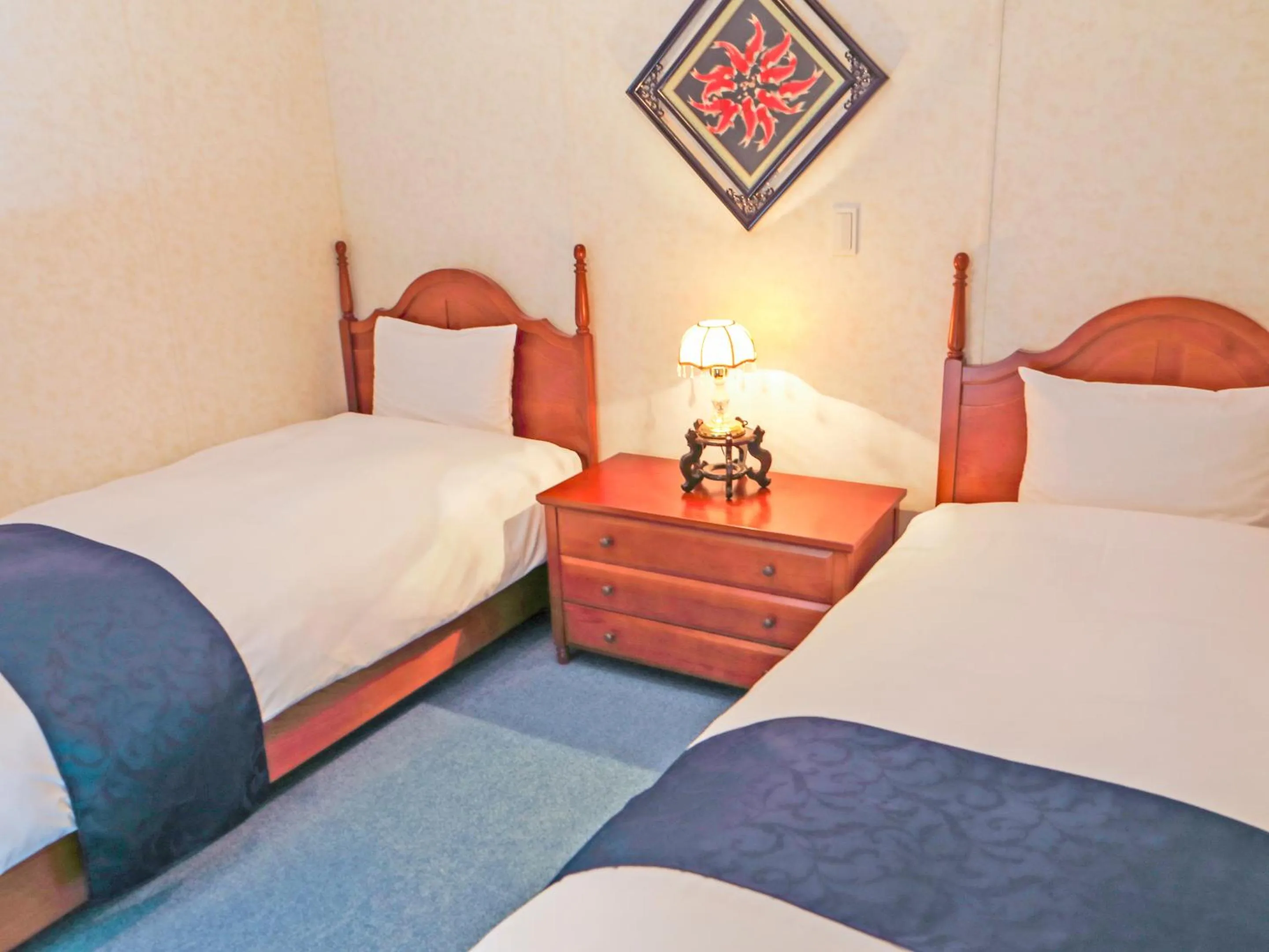 Bed in コテージスターハウス今帰仁